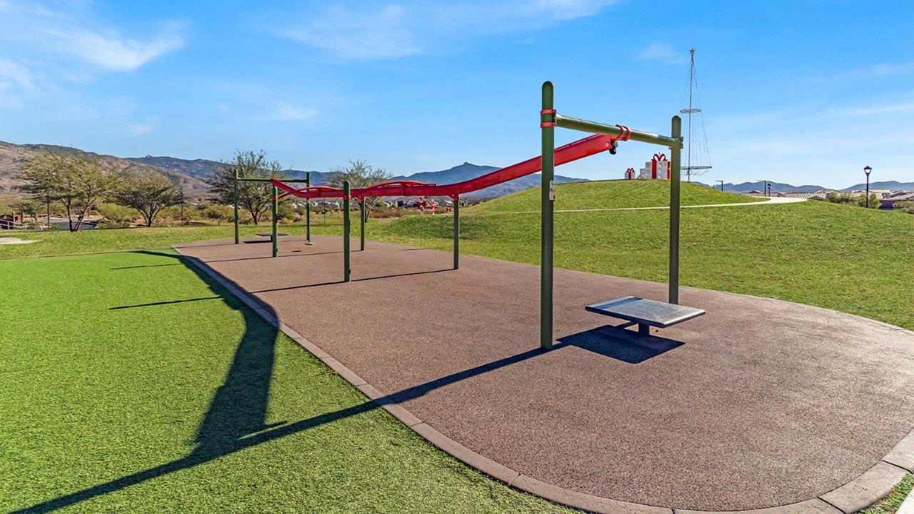 The Juniper at The Oasis at Rocking K presents an exceptional living experience that blends comfort and style within its thoughtfully crafted 2,439 square feet. This two-story, four-bedroom, two full bathroom, and one half-bathroom home offers space and room to grow. This home features a three-car tandem garage. The Juniper home is designed to cater to a variety of lifestyle needs, offering both privacy and open spaces that encourage togetherness. As you step into the welcoming entryway, you're led into a spacious great room that seamlessly connects with the dining room and kitchen, creating a perfect setting for daily living and entertaining. The kitchen is a true culinary delight, featuring elegant countertops, shaker-style cabinets, and a modern layout that includes a pantry for additional storage.  Welcome to The Juniper at Oasis at Rocking K, a premier D.R. Horton new home community nestled in the picturesque landscapes of Vail, Arizona, where new homes blend seamlessly with the breathtaking surroundings of the Rincon Mountains. Experience the perfect balance of tranquility and modern convenience in this master-planned neighborhood, designed to offer a lifestyle that caters to families, nature enthusiasts, and anyone seeking a peaceful yet connected community.  Each home in The Oasis at Rocking K is equipped with D.R. Horton’s Home is Connected® Smart Home package, which includes a smart thermostat, video doorbell, keyless entry, Wi-Fi-enabled garage door opener, and Deako light switches. Additionally, these homes meet the stringent DOE Zero Energy Ready Home standards, making them not only comfortable and modern but also exceptionally energy efficient. With features like spray foam insulation, tankless water heaters and LED lighting, these homes are designed to reduce your environmental footprint and provide long-term savings on energy costs.  Living at Rocking K means being part of a vibrant, family-oriented community with a strong sense of connection among residents. The Oasis at Rocking K offers a variety of amenities, including ramadas, picnic tables, and grassy areas perfect for gatherings. Residents also have access to the greater Rocking K master-planned neighborhood amenities, such as a splashpad, large event lawn, walking paths, multipurpose fields, basketball and pickleball courts, and an innovative playground with a zip-line and jungle gym. The new K-8 school, set to open in 2025, is just one of the many features that make Rocking K ideal for families.  Life at Rocking K is further enriched by a lively calendar of lifestyle events, thoughtfully organized by the Rocking K Homeowners Association. These events are a cornerstone of community life, fostering a strong sense of connection among residents. Whether you’re looking to enjoy a quiet evening star gazing in the park or engage in fun activities with neighbors, there’s always something happening. The quarterly lifestyle calendar is packed with regular and seasonal events, including movie nights in the park, sports and summer camps for kids, and wine tasting events for adults. Families can join hiking groups, participate in trivia nights, or enjoy the various holiday celebrations. The community comes alive during the holidays with loads of themed events, arts and crafts fairs, and car shows. Rocking K’s commitment to providing a dynamic and engaging environment ensures that there’s always an opportunity to make memories and build lasting friendships right in your neighborhood.  Residents of Rocking K benefit from easy access to I-10, making commutes to Tucson and surrounding areas a breeze. The community is close to major employers such as Davis-Monthan Air Force Base, Raytheon, and the University of Arizona, as well as top-notch healthcare facilities like TMC Rincon and Northwest Hospital East. The nearby Houghton Town Center and Houghton Rd. business corridor offer convenient shopping, dining, and services.  For outdoor enthusiasts, Rocking K is surrounded by natural beauty and recreational opportunities. Explore the hiking and biking trails at Colossal Cave Mountain Park, Saguaro National Park East, and the Arizona Trail. Enjoy golfing at Del Lago Golf Course or take a short drive to Sonoita for a day trip to Arizona’s Wine Country. Whether it’s hiking, camping, or simply taking in the stunning views, Rocking K is your gateway to the great outdoors. With 360-degree mountain views, calm and quiet evenings, and a location that’s close to everything you need, Rocking K is truly a community where you can thrive. Experience the best of Arizona living at The Oasis at Rocking K, where your new home awaits in a community that offers everything you need for a fulfilling lifestyle.