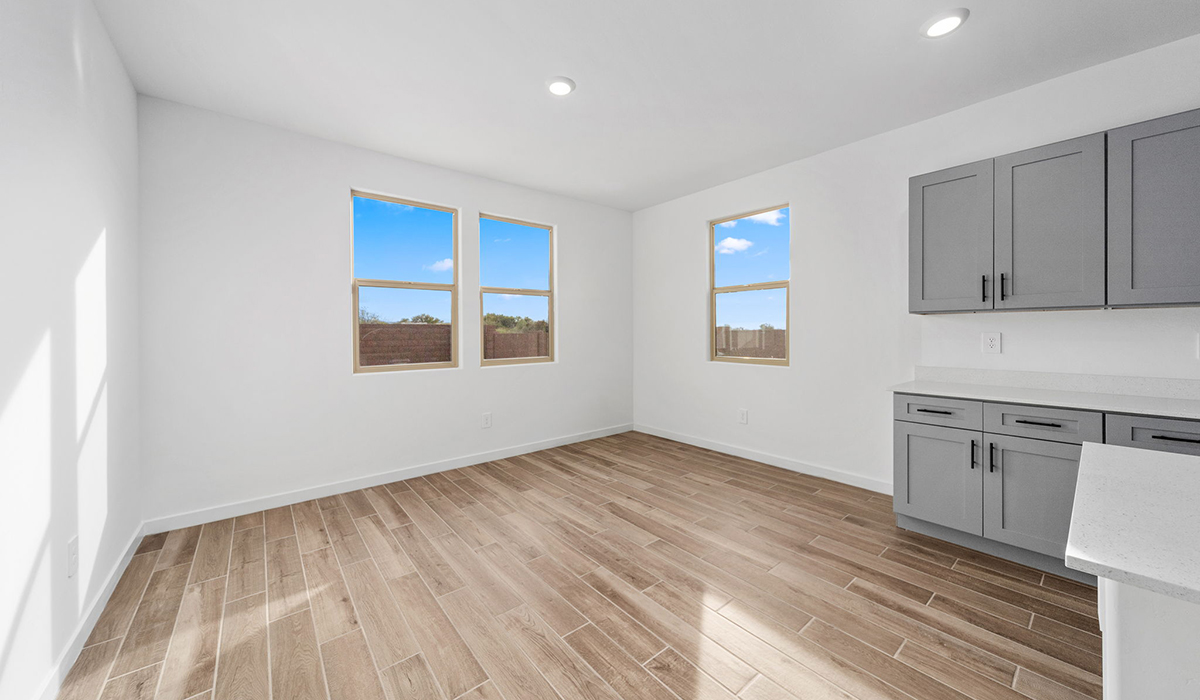 The Juniper at The Oasis at Rocking K presents an exceptional living experience that blends comfort and style within its thoughtfully crafted 2,439 square feet. This two-story, four-bedroom, two full bathroom, and one half-bathroom home offers space and room to grow. This home features a three-car tandem garage. The Juniper home is designed to cater to a variety of lifestyle needs, offering both privacy and open spaces that encourage togetherness. As you step into the welcoming entryway, you're led into a spacious great room that seamlessly connects with the dining room and kitchen, creating a perfect setting for daily living and entertaining. The kitchen is a true culinary delight, featuring elegant countertops, shaker-style cabinets, and a modern layout that includes a pantry for additional storage.  Welcome to The Juniper at Oasis at Rocking K, a premier D.R. Horton new home community nestled in the picturesque landscapes of Vail, Arizona, where new homes blend seamlessly with the breathtaking surroundings of the Rincon Mountains. Experience the perfect balance of tranquility and modern convenience in this master-planned neighborhood, designed to offer a lifestyle that caters to families, nature enthusiasts, and anyone seeking a peaceful yet connected community.  Each home in The Oasis at Rocking K is equipped with D.R. Horton’s Home is Connected® Smart Home package, which includes a smart thermostat, video doorbell, keyless entry, Wi-Fi-enabled garage door opener, and Deako light switches. Additionally, these homes meet the stringent DOE Zero Energy Ready Home standards, making them not only comfortable and modern but also exceptionally energy efficient. With features like spray foam insulation, tankless water heaters and LED lighting, these homes are designed to reduce your environmental footprint and provide long-term savings on energy costs.  Living at Rocking K means being part of a vibrant, family-oriented community with a strong sense of connection among residents. The Oasis at Rocking K offers a variety of amenities, including ramadas, picnic tables, and grassy areas perfect for gatherings. Residents also have access to the greater Rocking K master-planned neighborhood amenities, such as a splashpad, large event lawn, walking paths, multipurpose fields, basketball and pickleball courts, and an innovative playground with a zip-line and jungle gym. The new K-8 school, set to open in 2025, is just one of the many features that make Rocking K ideal for families. Life at Rocking K is further enriched by a lively calendar of lifestyle events, thoughtfully organized by the Rocking K Homeowners Association. These events are a cornerstone of community life, fostering a strong sense of connection among residents. Whether you’re looking to enjoy a quiet evening star gazing in the park or engage in fun activities with neighbors, there’s always something happening. The quarterly lifestyle calendar is packed with regular and seasonal events, including movie nights in the park, sports and summer camps for kids, and wine tasting events for adults. Families can join hiking groups, participate in trivia nights, or enjoy the various holiday celebrations. The community comes alive during the holidays with loads of themed events, arts and crafts fairs, and car shows. Rocking K’s commitment to providing a dynamic and engaging environment ensures that there’s always an opportunity to make memories and build lasting friendships right in your neighborhood.  Residents of Rocking K benefit from easy access to I-10, making commutes to Tucson and surrounding areas a breeze. The community is close to major employers such as Davis-Monthan Air Force Base, Raytheon, and the University of Arizona, as well as top-notch healthcare facilities like TMC Rincon and Northwest Hospital East. The nearby Houghton Town Center and Houghton Rd. business corridor offer convenient shopping, dining, and services. For outdoor enthusiasts, Rocking K is surrounded by natural beauty and recreational opportunities. Explore the hiking and biking trails at Colossal Cave Mountain Park, Saguaro National Park East, and the Arizona Trail. Enjoy golfing at Del Lago Golf Course or take a short drive to Sonoita for a day trip to Arizona’s Wine Country. Whether it’s hiking, camping, or simply taking in the stunning views, Rocking K is your gateway to the great outdoors. With 360-degree mountain views, calm and quiet evenings, and a location that’s close to everything you need, Rocking K is truly a community where you can thrive. Experience the best of Arizona living at The Oasis at Rocking K, where your new home awaits in a community that offers everything you need for a fulfilling lifestyle.  *Images shown are for reference only. They depict the Juniper model home and include virtual staging and may not represent the actual home.