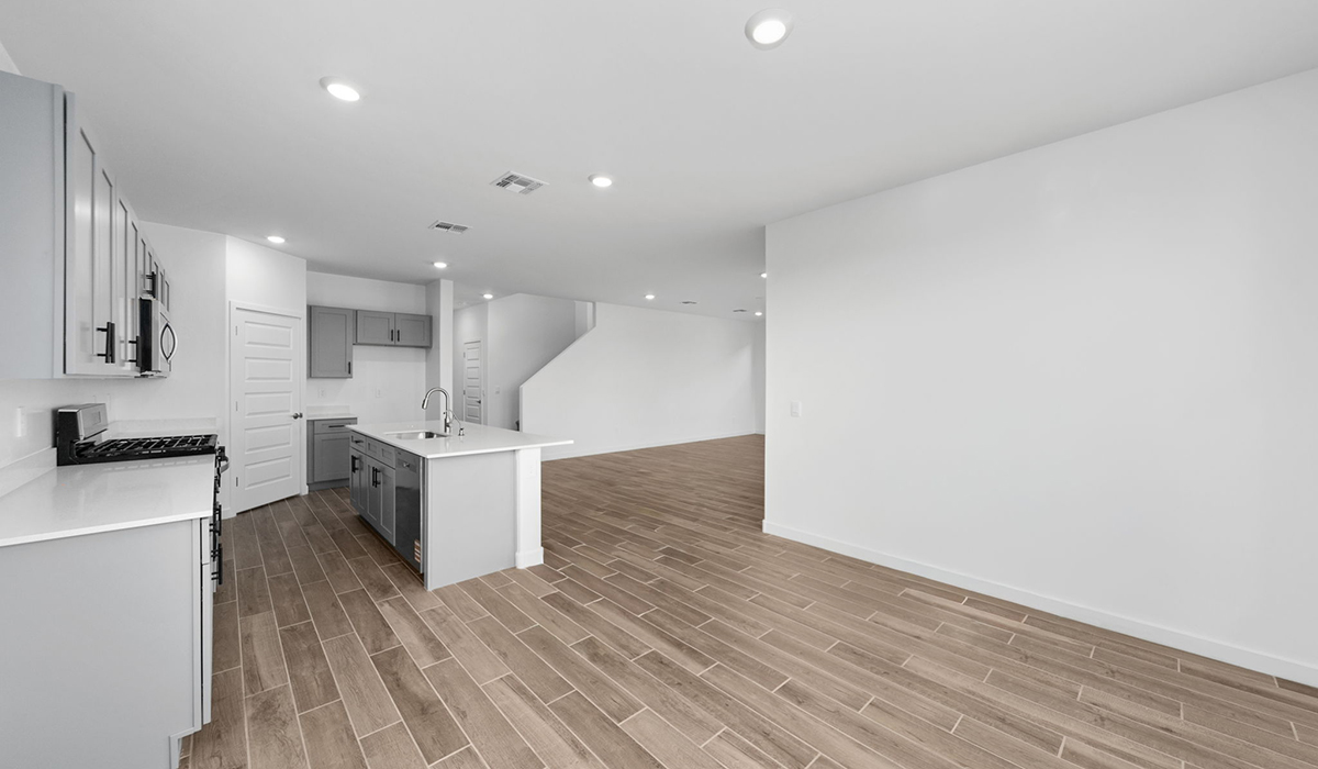 The Juniper at The Oasis at Rocking K presents an exceptional living experience that blends comfort and style within its thoughtfully crafted 2,439 square feet. This two-story, four-bedroom, two full bathroom, and one half-bathroom home offers space and room to grow. This home features a three-car tandem garage. The Juniper home is designed to cater to a variety of lifestyle needs, offering both privacy and open spaces that encourage togetherness. As you step into the welcoming entryway, you're led into a spacious great room that seamlessly connects with the dining room and kitchen, creating a perfect setting for daily living and entertaining. The kitchen is a true culinary delight, featuring elegant countertops, shaker-style cabinets, and a modern layout that includes a pantry for additional storage.  Welcome to The Juniper at Oasis at Rocking K, a premier D.R. Horton new home community nestled in the picturesque landscapes of Vail, Arizona, where new homes blend seamlessly with the breathtaking surroundings of the Rincon Mountains. Experience the perfect balance of tranquility and modern convenience in this master-planned neighborhood, designed to offer a lifestyle that caters to families, nature enthusiasts, and anyone seeking a peaceful yet connected community.  Each home in The Oasis at Rocking K is equipped with D.R. Horton’s Home is Connected® Smart Home package, which includes a smart thermostat, video doorbell, keyless entry, Wi-Fi-enabled garage door opener, and Deako light switches. Additionally, these homes meet the stringent DOE Zero Energy Ready Home standards, making them not only comfortable and modern but also exceptionally energy efficient. With features like spray foam insulation, tankless water heaters and LED lighting, these homes are designed to reduce your environmental footprint and provide long-term savings on energy costs.  Living at Rocking K means being part of a vibrant, family-oriented community with a strong sense of connection among residents. The Oasis at Rocking K offers a variety of amenities, including ramadas, picnic tables, and grassy areas perfect for gatherings. Residents also have access to the greater Rocking K master-planned neighborhood amenities, such as a splashpad, large event lawn, walking paths, multipurpose fields, basketball and pickleball courts, and an innovative playground with a zip-line and jungle gym. The new K-8 school, set to open in 2025, is just one of the many features that make Rocking K ideal for families. Life at Rocking K is further enriched by a lively calendar of lifestyle events, thoughtfully organized by the Rocking K Homeowners Association. These events are a cornerstone of community life, fostering a strong sense of connection among residents. Whether you’re looking to enjoy a quiet evening star gazing in the park or engage in fun activities with neighbors, there’s always something happening. The quarterly lifestyle calendar is packed with regular and seasonal events, including movie nights in the park, sports and summer camps for kids, and wine tasting events for adults. Families can join hiking groups, participate in trivia nights, or enjoy the various holiday celebrations. The community comes alive during the holidays with loads of themed events, arts and crafts fairs, and car shows. Rocking K’s commitment to providing a dynamic and engaging environment ensures that there’s always an opportunity to make memories and build lasting friendships right in your neighborhood.  Residents of Rocking K benefit from easy access to I-10, making commutes to Tucson and surrounding areas a breeze. The community is close to major employers such as Davis-Monthan Air Force Base, Raytheon, and the University of Arizona, as well as top-notch healthcare facilities like TMC Rincon and Northwest Hospital East. The nearby Houghton Town Center and Houghton Rd. business corridor offer convenient shopping, dining, and services. For outdoor enthusiasts, Rocking K is surrounded by natural beauty and recreational opportunities. Explore the hiking and biking trails at Colossal Cave Mountain Park, Saguaro National Park East, and the Arizona Trail. Enjoy golfing at Del Lago Golf Course or take a short drive to Sonoita for a day trip to Arizona’s Wine Country. Whether it’s hiking, camping, or simply taking in the stunning views, Rocking K is your gateway to the great outdoors. With 360-degree mountain views, calm and quiet evenings, and a location that’s close to everything you need, Rocking K is truly a community where you can thrive. Experience the best of Arizona living at The Oasis at Rocking K, where your new home awaits in a community that offers everything you need for a fulfilling lifestyle.  *Images shown are for reference only. They depict the Juniper model home and include virtual staging and may not represent the actual home.