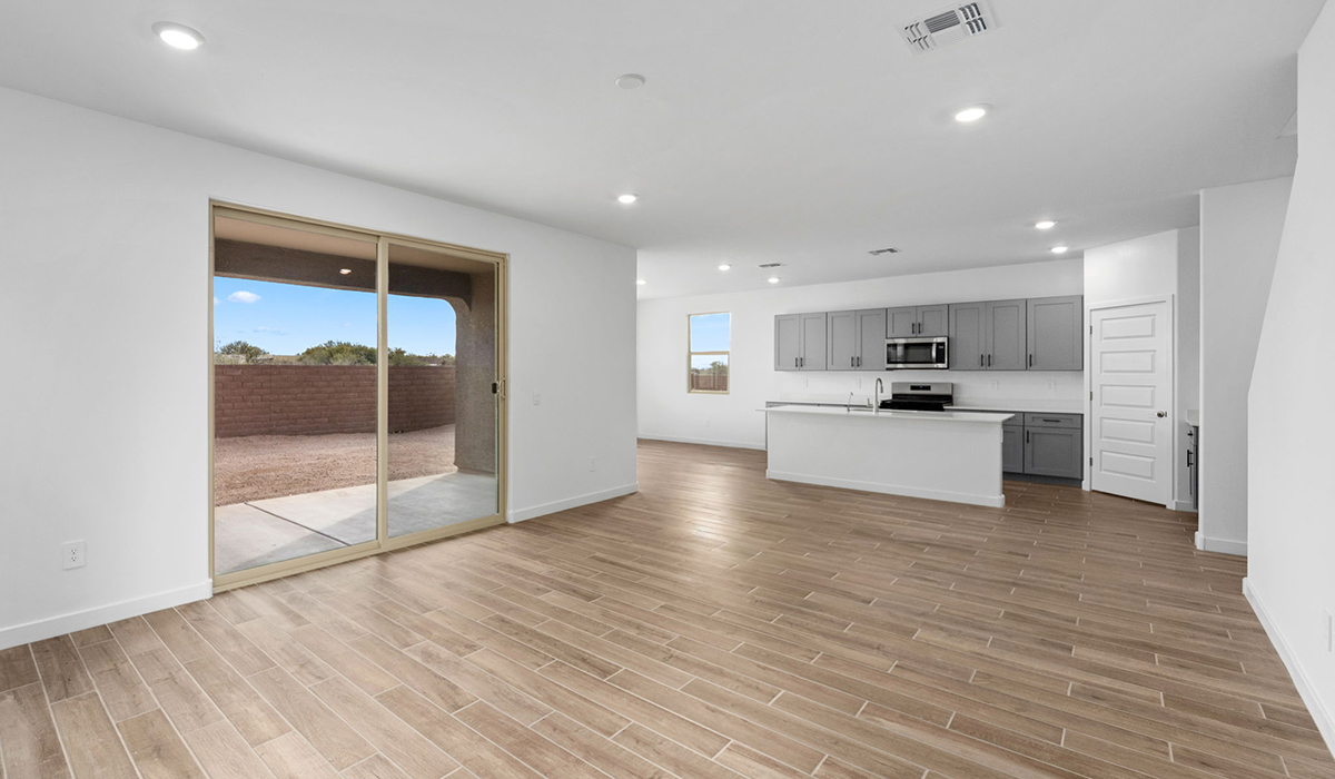 The Juniper at The Oasis at Rocking K presents an exceptional living experience that blends comfort and style within its thoughtfully crafted 2,439 square feet. This two-story, four-bedroom, two full bathroom, and one half-bathroom home offers space and room to grow. This home features a three-car tandem garage. The Juniper home is designed to cater to a variety of lifestyle needs, offering both privacy and open spaces that encourage togetherness. As you step into the welcoming entryway, you're led into a spacious great room that seamlessly connects with the dining room and kitchen, creating a perfect setting for daily living and entertaining. The kitchen is a true culinary delight, featuring elegant countertops, shaker-style cabinets, and a modern layout that includes a pantry for additional storage.  Welcome to The Juniper at Oasis at Rocking K, a premier D.R. Horton new home community nestled in the picturesque landscapes of Vail, Arizona, where new homes blend seamlessly with the breathtaking surroundings of the Rincon Mountains. Experience the perfect balance of tranquility and modern convenience in this master-planned neighborhood, designed to offer a lifestyle that caters to families, nature enthusiasts, and anyone seeking a peaceful yet connected community.  Each home in The Oasis at Rocking K is equipped with D.R. Horton’s Home is Connected® Smart Home package, which includes a smart thermostat, video doorbell, keyless entry, Wi-Fi-enabled garage door opener, and Deako light switches. Additionally, these homes meet the stringent DOE Zero Energy Ready Home standards, making them not only comfortable and modern but also exceptionally energy efficient. With features like spray foam insulation, tankless water heaters and LED lighting, these homes are designed to reduce your environmental footprint and provide long-term savings on energy costs.  Living at Rocking K means being part of a vibrant, family-oriented community with a strong sense of connection among residents. The Oasis at Rocking K offers a variety of amenities, including ramadas, picnic tables, and grassy areas perfect for gatherings. Residents also have access to the greater Rocking K master-planned neighborhood amenities, such as a splashpad, large event lawn, walking paths, multipurpose fields, basketball and pickleball courts, and an innovative playground with a zip-line and jungle gym. The new K-8 school, set to open in 2025, is just one of the many features that make Rocking K ideal for families. Life at Rocking K is further enriched by a lively calendar of lifestyle events, thoughtfully organized by the Rocking K Homeowners Association. These events are a cornerstone of community life, fostering a strong sense of connection among residents. Whether you’re looking to enjoy a quiet evening star gazing in the park or engage in fun activities with neighbors, there’s always something happening. The quarterly lifestyle calendar is packed with regular and seasonal events, including movie nights in the park, sports and summer camps for kids, and wine tasting events for adults. Families can join hiking groups, participate in trivia nights, or enjoy the various holiday celebrations. The community comes alive during the holidays with loads of themed events, arts and crafts fairs, and car shows. Rocking K’s commitment to providing a dynamic and engaging environment ensures that there’s always an opportunity to make memories and build lasting friendships right in your neighborhood.  Residents of Rocking K benefit from easy access to I-10, making commutes to Tucson and surrounding areas a breeze. The community is close to major employers such as Davis-Monthan Air Force Base, Raytheon, and the University of Arizona, as well as top-notch healthcare facilities like TMC Rincon and Northwest Hospital East. The nearby Houghton Town Center and Houghton Rd. business corridor offer convenient shopping, dining, and services. For outdoor enthusiasts, Rocking K is surrounded by natural beauty and recreational opportunities. Explore the hiking and biking trails at Colossal Cave Mountain Park, Saguaro National Park East, and the Arizona Trail. Enjoy golfing at Del Lago Golf Course or take a short drive to Sonoita for a day trip to Arizona’s Wine Country. Whether it’s hiking, camping, or simply taking in the stunning views, Rocking K is your gateway to the great outdoors. With 360-degree mountain views, calm and quiet evenings, and a location that’s close to everything you need, Rocking K is truly a community where you can thrive. Experience the best of Arizona living at The Oasis at Rocking K, where your new home awaits in a community that offers everything you need for a fulfilling lifestyle.  *Images shown are for reference only. They depict the Juniper model home and include virtual staging and may not represent the actual home.