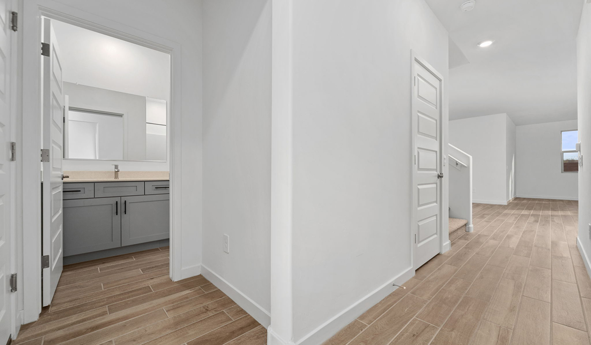 The Juniper at The Oasis at Rocking K presents an exceptional living experience that blends comfort and style within its thoughtfully crafted 2,439 square feet. This two-story, four-bedroom, two full bathroom, and one half-bathroom home offers space and room to grow. This home features a three-car tandem garage. The Juniper home is designed to cater to a variety of lifestyle needs, offering both privacy and open spaces that encourage togetherness. As you step into the welcoming entryway, you're led into a spacious great room that seamlessly connects with the dining room and kitchen, creating a perfect setting for daily living and entertaining. The kitchen is a true culinary delight, featuring elegant countertops, shaker-style cabinets, and a modern layout that includes a pantry for additional storage.  Welcome to The Juniper at Oasis at Rocking K, a premier D.R. Horton new home community nestled in the picturesque landscapes of Vail, Arizona, where new homes blend seamlessly with the breathtaking surroundings of the Rincon Mountains. Experience the perfect balance of tranquility and modern convenience in this master-planned neighborhood, designed to offer a lifestyle that caters to families, nature enthusiasts, and anyone seeking a peaceful yet connected community.  Each home in The Oasis at Rocking K is equipped with D.R. Horton’s Home is Connected® Smart Home package, which includes a smart thermostat, video doorbell, keyless entry, Wi-Fi-enabled garage door opener, and Deako light switches. Additionally, these homes meet the stringent DOE Zero Energy Ready Home standards, making them not only comfortable and modern but also exceptionally energy efficient. With features like spray foam insulation, tankless water heaters and LED lighting, these homes are designed to reduce your environmental footprint and provide long-term savings on energy costs.  Living at Rocking K means being part of a vibrant, family-oriented community with a strong sense of connection among residents. The Oasis at Rocking K offers a variety of amenities, including ramadas, picnic tables, and grassy areas perfect for gatherings. Residents also have access to the greater Rocking K master-planned neighborhood amenities, such as a splashpad, large event lawn, walking paths, multipurpose fields, basketball and pickleball courts, and an innovative playground with a zip-line and jungle gym. The new K-8 school, set to open in 2025, is just one of the many features that make Rocking K ideal for families. Life at Rocking K is further enriched by a lively calendar of lifestyle events, thoughtfully organized by the Rocking K Homeowners Association. These events are a cornerstone of community life, fostering a strong sense of connection among residents. Whether you’re looking to enjoy a quiet evening star gazing in the park or engage in fun activities with neighbors, there’s always something happening. The quarterly lifestyle calendar is packed with regular and seasonal events, including movie nights in the park, sports and summer camps for kids, and wine tasting events for adults. Families can join hiking groups, participate in trivia nights, or enjoy the various holiday celebrations. The community comes alive during the holidays with loads of themed events, arts and crafts fairs, and car shows. Rocking K’s commitment to providing a dynamic and engaging environment ensures that there’s always an opportunity to make memories and build lasting friendships right in your neighborhood.  Residents of Rocking K benefit from easy access to I-10, making commutes to Tucson and surrounding areas a breeze. The community is close to major employers such as Davis-Monthan Air Force Base, Raytheon, and the University of Arizona, as well as top-notch healthcare facilities like TMC Rincon and Northwest Hospital East. The nearby Houghton Town Center and Houghton Rd. business corridor offer convenient shopping, dining, and services. For outdoor enthusiasts, Rocking K is surrounded by natural beauty and recreational opportunities. Explore the hiking and biking trails at Colossal Cave Mountain Park, Saguaro National Park East, and the Arizona Trail. Enjoy golfing at Del Lago Golf Course or take a short drive to Sonoita for a day trip to Arizona’s Wine Country. Whether it’s hiking, camping, or simply taking in the stunning views, Rocking K is your gateway to the great outdoors. With 360-degree mountain views, calm and quiet evenings, and a location that’s close to everything you need, Rocking K is truly a community where you can thrive. Experience the best of Arizona living at The Oasis at Rocking K, where your new home awaits in a community that offers everything you need for a fulfilling lifestyle.  *Images shown are for reference only. They depict the Juniper model home and include virtual staging and may not represent the actual home.