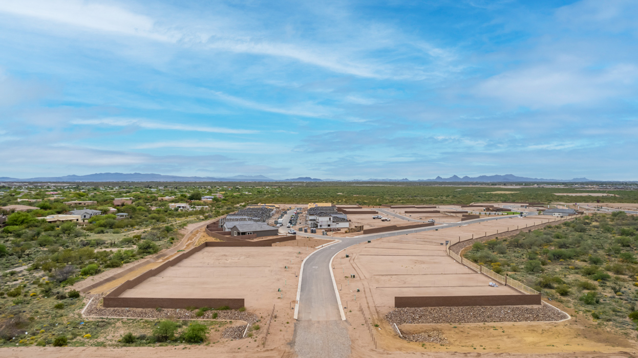 The Juniper at The Oasis at Rocking K presents an exceptional living experience that blends comfort and style within its thoughtfully crafted 2,439 square feet. This two-story, four-bedroom, two full bathroom, and one half-bathroom home offers space and room to grow. This home features a three-car tandem garage. The Juniper home is designed to cater to a variety of lifestyle needs, offering both privacy and open spaces that encourage togetherness. As you step into the welcoming entryway, you're led into a spacious great room that seamlessly connects with the dining room and kitchen, creating a perfect setting for daily living and entertaining. The kitchen is a true culinary delight, featuring elegant countertops, shaker-style cabinets, and a modern layout that includes a pantry for additional storage.  Welcome to The Juniper at Oasis at Rocking K, a premier D.R. Horton new home community nestled in the picturesque landscapes of Vail, Arizona, where new homes blend seamlessly with the breathtaking surroundings of the Rincon Mountains. Experience the perfect balance of tranquility and modern convenience in this master-planned neighborhood, designed to offer a lifestyle that caters to families, nature enthusiasts, and anyone seeking a peaceful yet connected community.  Each home in The Oasis at Rocking K is equipped with D.R. Horton’s Home is Connected® Smart Home package, which includes a smart thermostat, video doorbell, keyless entry, Wi-Fi-enabled garage door opener, and Deako light switches. Additionally, these homes meet the stringent DOE Zero Energy Ready Home standards, making them not only comfortable and modern but also exceptionally energy efficient. With features like spray foam insulation, tankless water heaters and LED lighting, these homes are designed to reduce your environmental footprint and provide long-term savings on energy costs.  Living at Rocking K means being part of a vibrant, family-oriented community with a strong sense of connection among residents. The Oasis at Rocking K offers a variety of amenities, including ramadas, picnic tables, and grassy areas perfect for gatherings. Residents also have access to the greater Rocking K master-planned neighborhood amenities, such as a splashpad, large event lawn, walking paths, multipurpose fields, basketball and pickleball courts, and an innovative playground with a zip-line and jungle gym. The new K-8 school, set to open in 2025, is just one of the many features that make Rocking K ideal for families.  Life at Rocking K is further enriched by a lively calendar of lifestyle events, thoughtfully organized by the Rocking K Homeowners Association. These events are a cornerstone of community life, fostering a strong sense of connection among residents. Whether you’re looking to enjoy a quiet evening star gazing in the park or engage in fun activities with neighbors, there’s always something happening. The quarterly lifestyle calendar is packed with regular and seasonal events, including movie nights in the park, sports and summer camps for kids, and wine tasting events for adults. Families can join hiking groups, participate in trivia nights, or enjoy the various holiday celebrations. The community comes alive during the holidays with loads of themed events, arts and crafts fairs, and car shows. Rocking K’s commitment to providing a dynamic and engaging environment ensures that there’s always an opportunity to make memories and build lasting friendships right in your neighborhood.  Residents of Rocking K benefit from easy access to I-10, making commutes to Tucson and surrounding areas a breeze. The community is close to major employers such as Davis-Monthan Air Force Base, Raytheon, and the University of Arizona, as well as top-notch healthcare facilities like TMC Rincon and Northwest Hospital East. The nearby Houghton Town Center and Houghton Rd. business corridor offer convenient shopping, dining, and services.  For outdoor enthusiasts, Rocking K is surrounded by natural beauty and recreational opportunities. Explore the hiking and biking trails at Colossal Cave Mountain Park, Saguaro National Park East, and the Arizona Trail. Enjoy golfing at Del Lago Golf Course or take a short drive to Sonoita for a day trip to Arizona’s Wine Country. Whether it’s hiking, camping, or simply taking in the stunning views, Rocking K is your gateway to the great outdoors. With 360-degree mountain views, calm and quiet evenings, and a location that’s close to everything you need, Rocking K is truly a community where you can thrive. Experience the best of Arizona living at The Oasis at Rocking K, where your new home awaits in a community that offers everything you need for a fulfilling lifestyle.