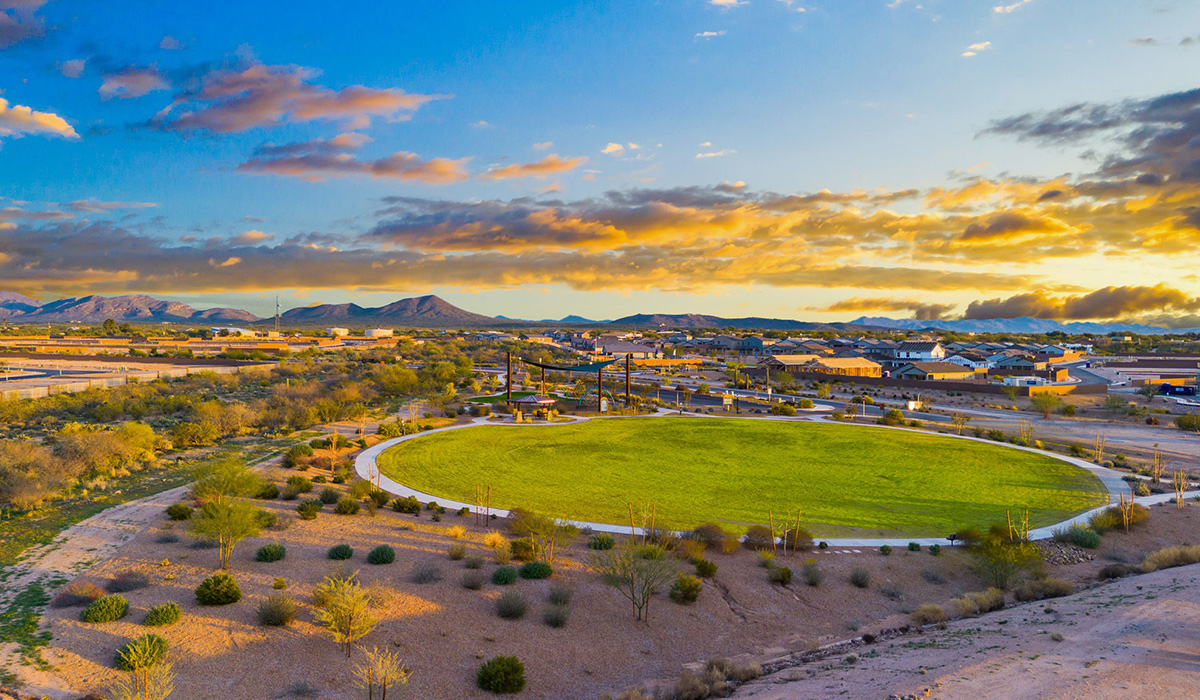 Welcome to The Oasis at Rocking K, a premier D.R. Horton new home community nestled in the picturesque landscapes of Vail, Arizona, where new homes blend seamlessly with the breathtaking surroundings of the Rincon Mountains. Experience the perfect balance of tranquility and modern convenience in this master-planned neighborhood, designed to offer a lifestyle that caters to families, nature enthusiasts, and anyone seeking a peaceful yet connected community.  The Oasis at Rocking K features five beautifully designed one-story floor plans ranging from 1,400 to 1,900 square feet, each crafted with the high-quality features and finishes D.R. Horton is known for. Homes in Rocking K feature a Spanish lace stucco exterior, tile roofs, and meticulously landscaped front yards with auto drip irrigation. Inside, you’ll find luxurious quartz countertops in the kitchens and bathrooms, 42” shaker-style cabinets with modern cabinet pulls, and wood-look tile flooring throughout the main living areas. Homes also include covered front porches and back patios, perfect for enjoying Arizona’s stunning sunsets and clear night skies.  Each home in The Oasis at Rocking K is equipped with D.R. Horton’s Home is Connected® Smart Home package, which includes a smart thermostat, video doorbell, keyless entry, Wi-Fi-enabled garage door opener, and Deako light switches. Additionally, these homes meet the stringent DOE Zero Energy Ready Home standards, making them not only comfortable and modern but also exceptionally energy-efficient. With features like spray foam insulation, tankless water heaters and LED lighting, these homes are designed to reduce your environmental footprint and provide long-term savings on energy costs.  Living at Rocking K means being part of a vibrant, family-oriented community with a strong sense of connection among residents. The Oasis at Rocking K offers a variety of amenities, including ramadas, picnic tables, and grassy areas perfect for gatherings. Residents also have access to the greater Rocking K master-planned neighborhood amenities, such as a splashpad, large event lawn, walking paths, multipurpose fields, basketball and pickleball courts, and an innovative playground with a zip-line and jungle gym. The new K-8 school, set to open in 2025, is just one of the many features that make Rocking K ideal for families.  Life at Rocking K is further enriched by a lively calendar of lifestyle events, thoughtfully organized by the Rocking K Homeowners Association. These events are a cornerstone of community life, fostering a strong sense of connection among residents. Whether you’re looking to enjoy a quiet evening star gazing in the park or engage in fun activities with neighbors, there’s always something happening. The quarterly lifestyle calendar is packed with regular and seasonal events, including movie nights in the park, sports and summer camps for kids, and wine tasting events for adults. Families can join hiking groups, participate in trivia nights, or enjoy the various holiday celebrations. The community comes alive during the holidays with loads of themed events, arts and crafts fairs, and car shows. Rocking K’s commitment to providing a dynamic and engaging environment ensures that there’s always an opportunity to make memories and build lasting friendships right in your neighborhood.   Residents of Rocking K benefit from easy access to I-10, making commutes to Tucson and surrounding areas a breeze. The community is close to major employers such as Davis-Monthan Air Force Base, Raytheon, and the University of Arizona, as well as top-notch healthcare facilities like TMC Rincon and Northwest Hospital East. The nearby Houghton Town Center and Houghton Rd. business corridor offer convenient shopping, dining, and services.  For outdoor enthusiasts, Rocking K is surrounded by natural beauty and recreational opportunities. Explore the hiking and biking trails at Colossal Cave Mountain Park, Saguaro National Park East, and the Arizona Trail. Enjoy golfing at Del Lago Golf Course, or take a short drive to Sonoita for a day trip to Arizona’s Wine Country. Whether it’s hiking, camping, or simply taking in the stunning views, Rocking K is your gateway to the great outdoors.  With 360-degree mountain views, calm and quiet evenings, and a location that’s close to everything you need, Rocking K is truly a community where you can thrive. Experience the best of Arizona living at The Oasis at Rocking K, where your new home awaits in a community that offers everything you need for a fulfilling lifestyle.