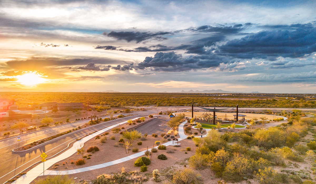 Welcome to The Oasis at Rocking K, a premier D.R. Horton new home community nestled in the picturesque landscapes of Vail, Arizona, where new homes blend seamlessly with the breathtaking surroundings of the Rincon Mountains. Experience the perfect balance of tranquility and modern convenience in this master-planned neighborhood, designed to offer a lifestyle that caters to families, nature enthusiasts, and anyone seeking a peaceful yet connected community.  The Oasis at Rocking K features five beautifully designed one-story floor plans ranging from 1,400 to 1,900 square feet, each crafted with the high-quality features and finishes D.R. Horton is known for. Homes in Rocking K feature a Spanish lace stucco exterior, tile roofs, and meticulously landscaped front yards with auto drip irrigation. Inside, you’ll find luxurious quartz countertops in the kitchens and bathrooms, 42” shaker-style cabinets with modern cabinet pulls, and wood-look tile flooring throughout the main living areas. Homes also include covered front porches and back patios, perfect for enjoying Arizona’s stunning sunsets and clear night skies.  Each home in The Oasis at Rocking K is equipped with D.R. Horton’s Home is Connected® Smart Home package, which includes a smart thermostat, video doorbell, keyless entry, Wi-Fi-enabled garage door opener, and Deako light switches. Additionally, these homes meet the stringent DOE Zero Energy Ready Home standards, making them not only comfortable and modern but also exceptionally energy-efficient. With features like spray foam insulation, tankless water heaters and LED lighting, these homes are designed to reduce your environmental footprint and provide long-term savings on energy costs.  Living at Rocking K means being part of a vibrant, family-oriented community with a strong sense of connection among residents. The Oasis at Rocking K offers a variety of amenities, including ramadas, picnic tables, and grassy areas perfect for gatherings. Residents also have access to the greater Rocking K master-planned neighborhood amenities, such as a splashpad, large event lawn, walking paths, multipurpose fields, basketball and pickleball courts, and an innovative playground with a zip-line and jungle gym. The new K-8 school, set to open in 2025, is just one of the many features that make Rocking K ideal for families.  Life at Rocking K is further enriched by a lively calendar of lifestyle events, thoughtfully organized by the Rocking K Homeowners Association. These events are a cornerstone of community life, fostering a strong sense of connection among residents. Whether you’re looking to enjoy a quiet evening star gazing in the park or engage in fun activities with neighbors, there’s always something happening. The quarterly lifestyle calendar is packed with regular and seasonal events, including movie nights in the park, sports and summer camps for kids, and wine tasting events for adults. Families can join hiking groups, participate in trivia nights, or enjoy the various holiday celebrations. The community comes alive during the holidays with loads of themed events, arts and crafts fairs, and car shows. Rocking K’s commitment to providing a dynamic and engaging environment ensures that there’s always an opportunity to make memories and build lasting friendships right in your neighborhood.   Residents of Rocking K benefit from easy access to I-10, making commutes to Tucson and surrounding areas a breeze. The community is close to major employers such as Davis-Monthan Air Force Base, Raytheon, and the University of Arizona, as well as top-notch healthcare facilities like TMC Rincon and Northwest Hospital East. The nearby Houghton Town Center and Houghton Rd. business corridor offer convenient shopping, dining, and services.  For outdoor enthusiasts, Rocking K is surrounded by natural beauty and recreational opportunities. Explore the hiking and biking trails at Colossal Cave Mountain Park, Saguaro National Park East, and the Arizona Trail. Enjoy golfing at Del Lago Golf Course, or take a short drive to Sonoita for a day trip to Arizona’s Wine Country. Whether it’s hiking, camping, or simply taking in the stunning views, Rocking K is your gateway to the great outdoors.  With 360-degree mountain views, calm and quiet evenings, and a location that’s close to everything you need, Rocking K is truly a community where you can thrive. Experience the best of Arizona living at The Oasis at Rocking K, where your new home awaits in a community that offers everything you need for a fulfilling lifestyle.