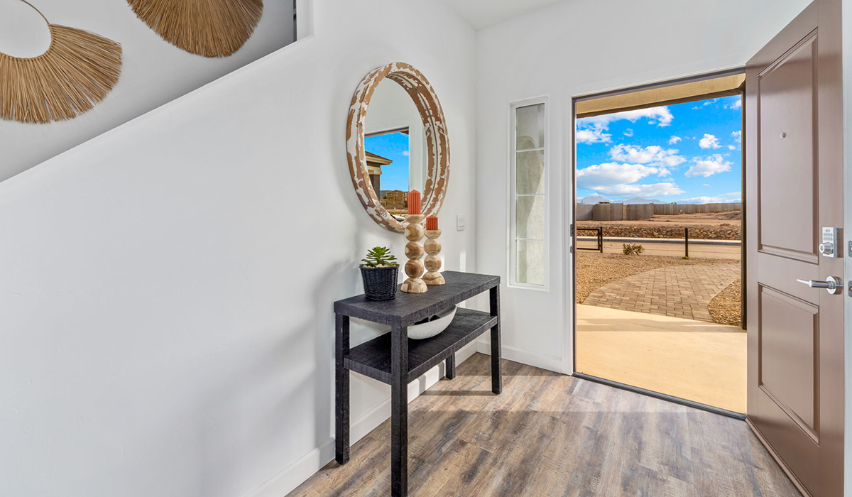 Discover the Gila, a brand new versatile two-story floor plan offering 2,057 sq. ft. of comfortable, modern living space now available at The Oasis at Rocking K by D.R. Horton in Vail, Arizona.  Thoughtfully crafted for households of all sizes, the Gila features four bedrooms, a spacious loft, and three full bathrooms, ensuring every family member has their own space to unwind and recharge. The main floor creates an inviting flow, with a generous great room that connects seamlessly to the dining area and kitchen.  A standout highlight of this home is the guest-style suite on the main floor, offering convenient access to a full bathroom. Perfect for visitors, multi-generational living, or private home office, this main-level bedroom offers exceptional flexibility.  Upstairs, The Gila continues to impress with thoughtful design and family-friendly layout. The well-appointed primary bedroom includes a private en-suite bathroom and large walk-in closet. Bedrooms 2 and 3, along with the loft, share a full bathroom conveniently located for easy access. An additional standout feature is Bedroom 2, which includes a large walk-in closet, a perfect setup for teens, young adults, or anyone who appreciates extra storage and personal space. The second floor also features a large laundry room, conveniently located near the bedrooms.  The Gila is designed with energy efficiency in mind and features tankless water heaters, energy-efficient LED lighting, and high-performance insulation, helping to lower utility costs. Additionally, this home is equipped with D.R. Horton’s Home is Connected Smart Home package, which includes a smart thermostat, video doorbell, keyless entry, and Wi-Fi® enabled garage door opener.  Step outside to a spacious backyard, where you can unwind and enjoy Vail’s beautiful weather year-round. Whether you’re sipping your morning coffee or hosting a weekend barbecue, this outdoor space serene surroundings of Rocking K.  Living in Rocking K offers a variety of amenities, including playgrounds with jungle gyms, parks, ramadas, and walking and biking trails that encourage a healthy, active lifestyle. Designed with energy efficiency in mind, The Gila at The Oasis at Rocking K is an Energy Ready Home, helping to lower utility costs, offering you long-term savings, and a sustainable living environment.  *Images shown are for reference only. They depict The Gila sales model home and may not represent the actual home.