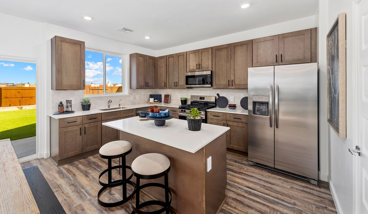 Discover the Gila, a brand new versatile two-story floor plan offering 2,057 sq. ft. of comfortable, modern living space now available at The Oasis at Rocking K by D.R. Horton in Vail, Arizona.  Thoughtfully crafted for households of all sizes, the Gila features four bedrooms, a spacious loft, and three full bathrooms, ensuring every family member has their own space to unwind and recharge. The main floor creates an inviting flow, with a generous great room that connects seamlessly to the dining area and kitchen.  A standout highlight of this home is the guest-style suite on the main floor, offering convenient access to a full bathroom. Perfect for visitors, multi-generational living, or private home office, this main-level bedroom offers exceptional flexibility.  Upstairs, The Gila continues to impress with thoughtful design and family-friendly layout. The well-appointed primary bedroom includes a private en-suite bathroom and large walk-in closet. Bedrooms 2 and 3, along with the loft, share a full bathroom conveniently located for easy access. An additional standout feature is Bedroom 2, which includes a large walk-in closet, a perfect setup for teens, young adults, or anyone who appreciates extra storage and personal space. The second floor also features a large laundry room, conveniently located near the bedrooms.  The Gila is designed with energy efficiency in mind and features tankless water heaters, energy-efficient LED lighting, and high-performance insulation, helping to lower utility costs. Additionally, this home is equipped with D.R. Horton’s Home is Connected Smart Home package, which includes a smart thermostat, video doorbell, keyless entry, and Wi-Fi® enabled garage door opener.  Step outside to a spacious backyard, where you can unwind and enjoy Vail’s beautiful weather year-round. Whether you’re sipping your morning coffee or hosting a weekend barbecue, this outdoor space serene surroundings of Rocking K.  Living in Rocking K offers a variety of amenities, including playgrounds with jungle gyms, parks, ramadas, and walking and biking trails that encourage a healthy, active lifestyle. Designed with energy efficiency in mind, The Gila at The Oasis at Rocking K is an Energy Ready Home, helping to lower utility costs, offering you long-term savings, and a sustainable living environment.  *Images shown are for reference only. They depict The Gila sales model home and may not represent the actual home.