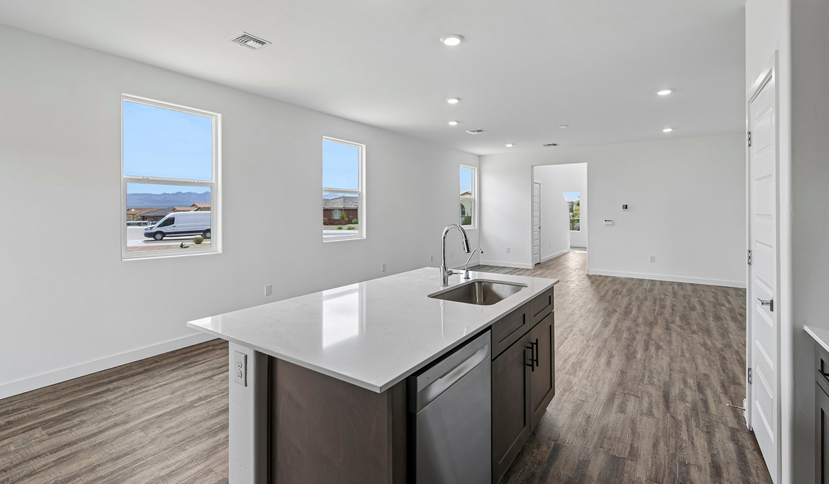 Introducing The Kleindale, a brand new stunning two-story home within the master-planned community of The Oasis at Rocking K by D.R. Horton in Vail, Arizona.  This spacious and beautifully designed two-story home offers 2,384 sq. ft., five bedrooms, three full bathrooms, and versatile 2-3 tandem car garage. This impressive layout is ideal for large households, multigenerational living, or anyone who simply wants room to grow, gather, and live comfortably.  A welcoming front porch leads you into the entryway, which flows into the expansive open-concept great room, dining area, and kitchen. The kitchen features stainless steel gas range, microwave, and dishwasher, and plenty of storage space. With thoughtful design and abundant natural light, the main floor truly feels like the heart of the home. One of the standout features of The Kleindale is the fifth bedroom located on the main floor with convenient access to a full bathroom, making it perfect for a guest suite or private home office.  A spacious and private second floor continues the living space with a generous loft leading to the primary bedroom, complete with an en-suite bathroom and large walk-in closet. Three additional bedrooms are also located on the second floor each offering plenty of space for family, guests, or work-from-home needs. The upstairs also includes a full bathroom and laundry room.  Our homes at Rocking K by D.R. Horton are designed with the future in mind. Each home features a light lace stucco exterior, landscaped front yards with auto drip irrigation, and large backyards that are fully fenced and ready for your personal touch. Inside, the Home is Connected® Smart Home package brings modern convenience to your fingertips with a smart thermostat, video doorbell, keyless entry, and a Wi-Fi® enabled garage door opener.  Step outside to a spacious backyard, where you can unwind and enjoy Vail’s beautiful weather year-round. Whether you’re sipping your morning coffee or hosting a weekend barbecue, this outdoor space serene surroundings of Rocking K.  With its expansive living spaces, flexible bedroom arrangements, and thoughtful deign throughout, The Kleindale offers the ultimate combination of comfort, convenience, and room to thrive. Living in Rocking K offers a variety of amenities, including playgrounds with jungle gyms, parks, ramadas, and walking and biking trails that encourage a healthy and active lifestyles.