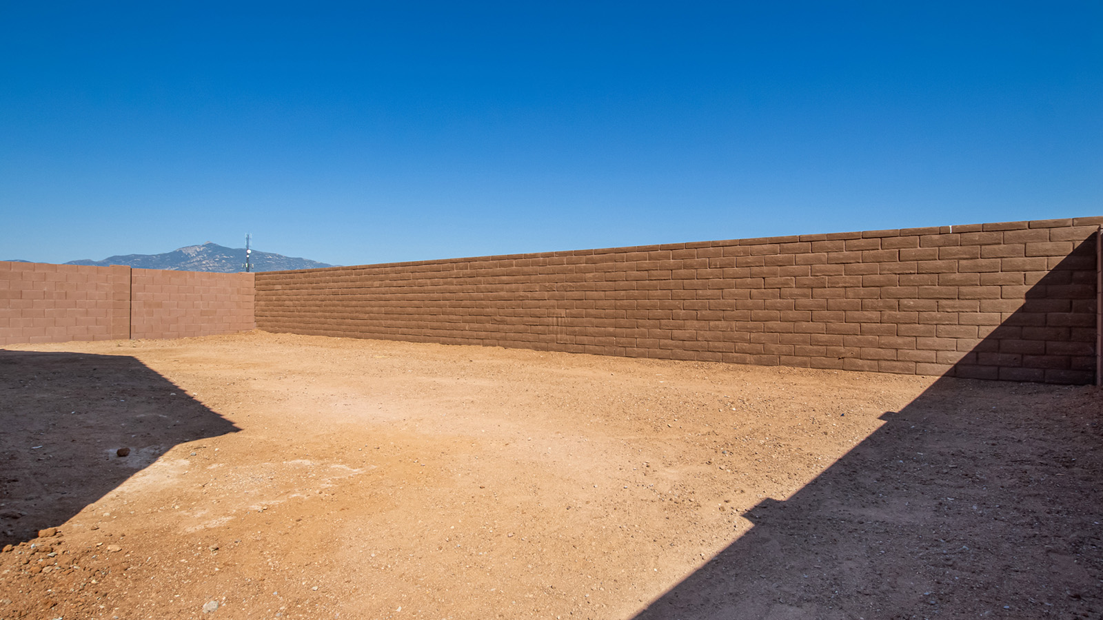 Explore The Baxter at The Oasis at Rocking K in Vail, Arizona, a meticulously designed single-story new home floorplan offering 1,423 square feet of beautifully appointed living space.  As you step inside, you'll immediately appreciate the open and inviting layout that seamlessly connects the great room, dining area, and kitchen. The heart of the home, the kitchen, is equipped with sleek stainless-steel appliances, including a built-in microwave and gas range. The central island with a breakfast bar serves as a gathering spot for casual meals and entertaining.  The adjacent dining room flows effortlessly into a covered patio, perfect for extending your living space outdoors. The great room, with its large windows, allows natural light to flood the space, creating a warm and welcoming atmosphere.  The primary suite is a private hideaway, featuring a spacious walk-in closet and an en-suite bathroom. Two additional bedrooms are located near the front of the home, offering ample space and privacy for family members or guests. These rooms share a well-appointed full bathroom.  Additional standard features of The Baxter include energy-efficient dual-pane windows, a tankless water heater, and smart home technology that allows you to control the thermostat, lighting, and security system from your smartphone. The home also comes with a fully landscaped front yard with automatic drip irrigation, ensuring your home looks beautiful with minimal effort.  The two-car garage, utility room with washer/dryer hookups, and abundant storage throughout the home make the Baxter not only stylish but incredibly functional, catering to the needs of modern living.  The Baxter at The Oasis at Rocking K is where thoughtful design meets convenience, making it the perfect home for those seeking a blend of comfort, style, and functionality.