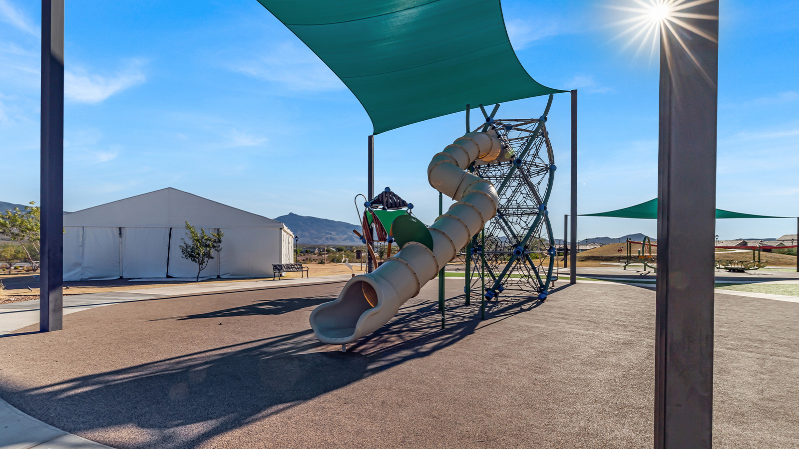 Explore The Baxter at The Oasis at Rocking K in Vail, Arizona, a meticulously designed single-story new home floorplan offering 1,423 square feet of beautifully appointed living space.  As you step inside, you'll immediately appreciate the open and inviting layout that seamlessly connects the great room, dining area, and kitchen. The heart of the home, the kitchen, is equipped with sleek stainless-steel appliances, including a built-in microwave and gas range. The central island with a breakfast bar serves as a gathering spot for casual meals and entertaining.  The adjacent dining room flows effortlessly into a covered patio, perfect for extending your living space outdoors. The great room, with its large windows, allows natural light to flood the space, creating a warm and welcoming atmosphere.  The primary suite is a private hideaway, featuring a spacious walk-in closet and an en-suite bathroom. Two additional bedrooms are located near the front of the home, offering ample space and privacy for family members or guests. These rooms share a well-appointed full bathroom.  Additional standard features of The Baxter include energy-efficient dual-pane windows, a tankless water heater, and smart home technology that allows you to control the thermostat, lighting, and security system from your smartphone. The home also comes with a fully landscaped front yard with automatic drip irrigation, ensuring your home looks beautiful with minimal effort.  The two-car garage, utility room with washer/dryer hookups, and abundant storage throughout the home make the Baxter not only stylish but incredibly functional, catering to the needs of modern living.  The Baxter at The Oasis at Rocking K is where thoughtful design meets convenience, making it the perfect home for those seeking a blend of comfort, style, and functionality.