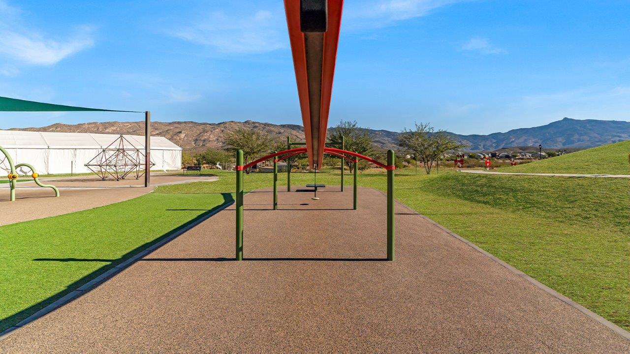 Explore The Baxter at The Oasis at Rocking K in Vail, Arizona, a meticulously designed single-story new home floorplan offering 1,423 square feet of beautifully appointed living space.  As you step inside, you'll immediately appreciate the open and inviting layout that seamlessly connects the great room, dining area, and kitchen. The heart of the home, the kitchen, is equipped with sleek stainless-steel appliances, including a built-in microwave and gas range. The central island with a breakfast bar serves as a gathering spot for casual meals and entertaining.  The adjacent dining room flows effortlessly into a covered patio, perfect for extending your living space outdoors. The great room, with its large windows, allows natural light to flood the space, creating a warm and welcoming atmosphere.  The primary suite is a private hideaway, featuring a spacious walk-in closet and an en-suite bathroom. Two additional bedrooms are located near the front of the home, offering ample space and privacy for family members or guests. These rooms share a well-appointed full bathroom.  Additional standard features of The Baxter include energy-efficient dual-pane windows, a tankless water heater, and smart home technology that allows you to control the thermostat, lighting, and security system from your smartphone. The home also comes with a fully landscaped front yard with automatic drip irrigation, ensuring your home looks beautiful with minimal effort.  The two-car garage, utility room with washer/dryer hookups, and abundant storage throughout the home make the Baxter not only stylish but incredibly functional, catering to the needs of modern living.  The Baxter at The Oasis at Rocking K is where thoughtful design meets convenience, making it the perfect home for those seeking a blend of comfort, style, and functionality.