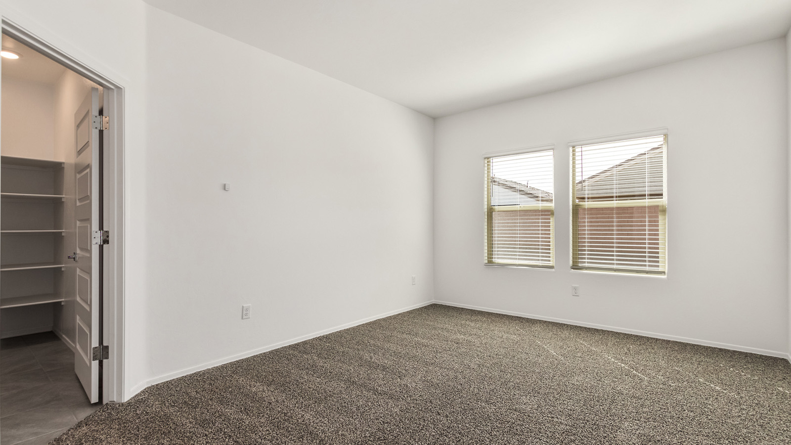 The Dalton at The Oasis at Rocking K presents an exceptional living experience that blends comfort and style within its thoughtfully crafted 1,569 square feet. This one-story, four-bedroom, two-bathroom home is designed to cater to a variety of lifestyle needs, offering both privacy and open spaces that encourage togetherness. As you step into the welcoming entryway, you're led into a spacious great room that seamlessly connects with the dining room and kitchen, creating a perfect setting for daily living and entertaining. The kitchen is a true culinary delight, featuring elegant quartz countertops, 42” shaker-style cabinets, and a modern layout that includes a pantry for additional storage.  The primary suite, located at the rear of the home, serves as a private oasis with a walk-in closet and a luxurious bathroom, complete with dual sinks and high-quality fixtures. The additional three bedrooms are positioned towards the front of the home, providing ample space for family, guests, or a home office setup. Each bedroom is well-proportioned, offering comfort and flexibility in their use.  The Dalton also features a covered patio, ideal for outdoor dining and relaxation, where you can enjoy the breathtaking views and Arizona sunsets that The Oasis at Rocking K is known for. The home includes a two-car garage, providing ample storage and parking space. Additionally, the front yard is meticulously landscaped with auto drip irrigation, ensuring your home’s curb appeal remains pristine year-round.  Living in The Oasis at Rocking K means enjoying a community filled with modern conveniences and natural beauty. Each home, including The Dalton, is equipped with D.R. Horton’s Home is Connected® Smart Home package, ensuring you have the latest in home automation technology. With additional energy-efficient features like spray foam insulation, a tankless water heater, and LED lighting, The Dalton is designed to offer long-term savings and environmental sustainability.  This home isn’t just a place to live; it’s part of a vibrant community where residents can take advantage of amenities such as walking trails, playgrounds, and community events that foster a strong sense of connection among neighbors. The Dalton at The Oasis at Rocking K isn’t just a house—it’s a home where memories are made and a fulfilling lifestyle awaits.