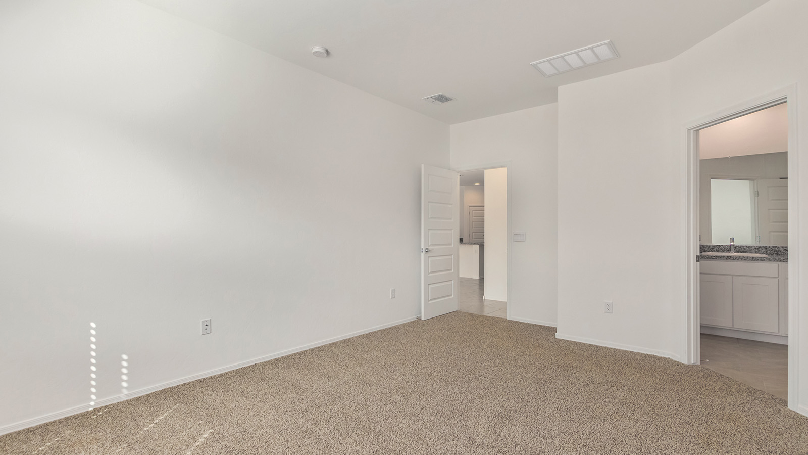 The Dalton at The Oasis at Rocking K presents an exceptional living experience that blends comfort and style within its thoughtfully crafted 1,569 square feet. This one-story, four-bedroom, two-bathroom home is designed to cater to a variety of lifestyle needs, offering both privacy and open spaces that encourage togetherness. As you step into the welcoming entryway, you're led into a spacious great room that seamlessly connects with the dining room and kitchen, creating a perfect setting for daily living and entertaining. The kitchen is a true culinary delight, featuring elegant quartz countertops, 42” shaker-style cabinets, and a modern layout that includes a pantry for additional storage.  The primary suite, located at the rear of the home, serves as a private oasis with a walk-in closet and a luxurious bathroom, complete with dual sinks and high-quality fixtures. The additional three bedrooms are positioned towards the front of the home, providing ample space for family, guests, or a home office setup. Each bedroom is well-proportioned, offering comfort and flexibility in their use.  The Dalton also features a covered patio, ideal for outdoor dining and relaxation, where you can enjoy the breathtaking views and Arizona sunsets that The Oasis at Rocking K is known for. The home includes a two-car garage, providing ample storage and parking space. Additionally, the front yard is meticulously landscaped with auto drip irrigation, ensuring your home’s curb appeal remains pristine year-round.  Living in The Oasis at Rocking K means enjoying a community filled with modern conveniences and natural beauty. Each home, including The Dalton, is equipped with D.R. Horton’s Home is Connected® Smart Home package, ensuring you have the latest in home automation technology. With additional energy-efficient features like spray foam insulation, a tankless water heater, and LED lighting, The Dalton is designed to offer long-term savings and environmental sustainability.  This home isn’t just a place to live; it’s part of a vibrant community where residents can take advantage of amenities such as walking trails, playgrounds, and community events that foster a strong sense of connection among neighbors. The Dalton at The Oasis at Rocking K isn’t just a house—it’s a home where memories are made and a fulfilling lifestyle awaits.