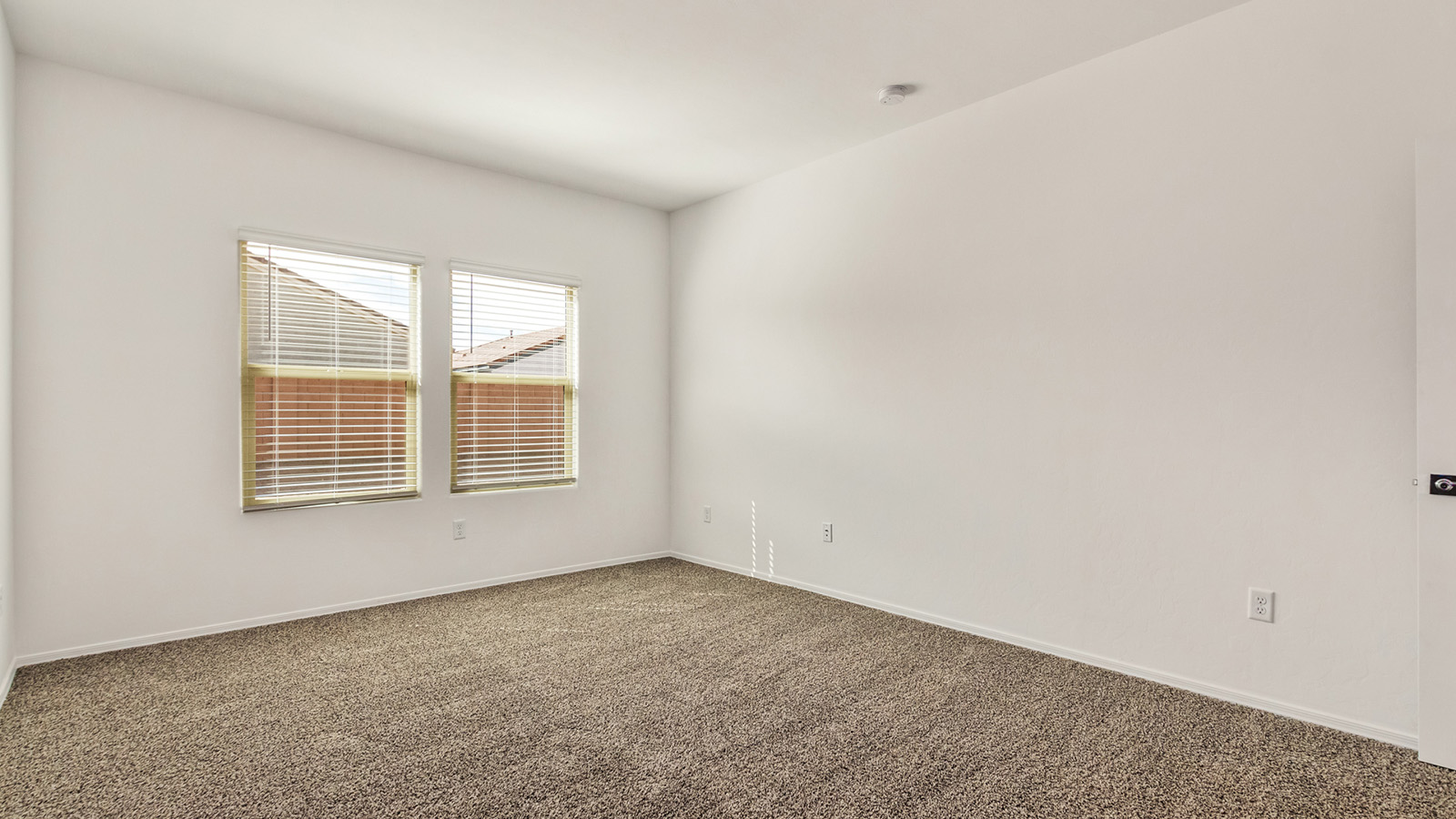 The Dalton at The Oasis at Rocking K presents an exceptional living experience that blends comfort and style within its thoughtfully crafted 1,569 square feet. This one-story, four-bedroom, two-bathroom home is designed to cater to a variety of lifestyle needs, offering both privacy and open spaces that encourage togetherness. As you step into the welcoming entryway, you're led into a spacious great room that seamlessly connects with the dining room and kitchen, creating a perfect setting for daily living and entertaining. The kitchen is a true culinary delight, featuring elegant quartz countertops, 42” shaker-style cabinets, and a modern layout that includes a pantry for additional storage.  The primary suite, located at the rear of the home, serves as a private oasis with a walk-in closet and a luxurious bathroom, complete with dual sinks and high-quality fixtures. The additional three bedrooms are positioned towards the front of the home, providing ample space for family, guests, or a home office setup. Each bedroom is well-proportioned, offering comfort and flexibility in their use.  The Dalton also features a covered patio, ideal for outdoor dining and relaxation, where you can enjoy the breathtaking views and Arizona sunsets that The Oasis at Rocking K is known for. The home includes a two-car garage, providing ample storage and parking space. Additionally, the front yard is meticulously landscaped with auto drip irrigation, ensuring your home’s curb appeal remains pristine year-round.  Living in The Oasis at Rocking K means enjoying a community filled with modern conveniences and natural beauty. Each home, including The Dalton, is equipped with D.R. Horton’s Home is Connected® Smart Home package, ensuring you have the latest in home automation technology. With additional energy-efficient features like spray foam insulation, a tankless water heater, and LED lighting, The Dalton is designed to offer long-term savings and environmental sustainability.  This home isn’t just a place to live; it’s part of a vibrant community where residents can take advantage of amenities such as walking trails, playgrounds, and community events that foster a strong sense of connection among neighbors. The Dalton at The Oasis at Rocking K isn’t just a house—it’s a home where memories are made and a fulfilling lifestyle awaits.