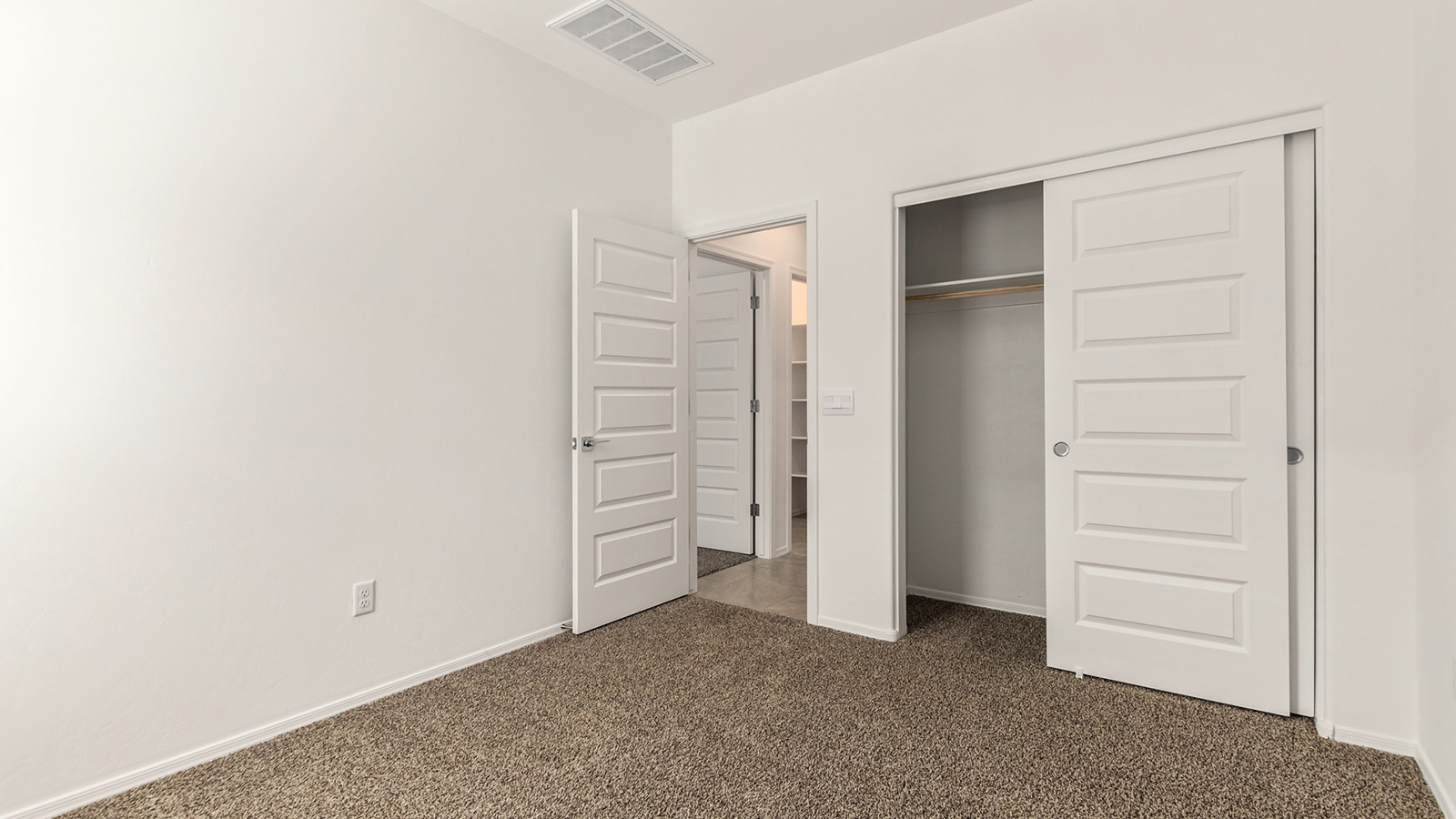 The Dalton at The Oasis at Rocking K presents an exceptional living experience that blends comfort and style within its thoughtfully crafted 1,569 square feet. This one-story, four-bedroom, two-bathroom home is designed to cater to a variety of lifestyle needs, offering both privacy and open spaces that encourage togetherness. As you step into the welcoming entryway, you're led into a spacious great room that seamlessly connects with the dining room and kitchen, creating a perfect setting for daily living and entertaining. The kitchen is a true culinary delight, featuring elegant quartz countertops, 42” shaker-style cabinets, and a modern layout that includes a pantry for additional storage.  The primary suite, located at the rear of the home, serves as a private oasis with a walk-in closet and a luxurious bathroom, complete with dual sinks and high-quality fixtures. The additional three bedrooms are positioned towards the front of the home, providing ample space for family, guests, or a home office setup. Each bedroom is well-proportioned, offering comfort and flexibility in their use.  The Dalton also features a covered patio, ideal for outdoor dining and relaxation, where you can enjoy the breathtaking views and Arizona sunsets that The Oasis at Rocking K is known for. The home includes a two-car garage, providing ample storage and parking space. Additionally, the front yard is meticulously landscaped with auto drip irrigation, ensuring your home’s curb appeal remains pristine year-round.  Living in The Oasis at Rocking K means enjoying a community filled with modern conveniences and natural beauty. Each home, including The Dalton, is equipped with D.R. Horton’s Home is Connected® Smart Home package, ensuring you have the latest in home automation technology. With additional energy-efficient features like spray foam insulation, a tankless water heater, and LED lighting, The Dalton is designed to offer long-term savings and environmental sustainability.  This home isn’t just a place to live; it’s part of a vibrant community where residents can take advantage of amenities such as walking trails, playgrounds, and community events that foster a strong sense of connection among neighbors. The Dalton at The Oasis at Rocking K isn’t just a house—it’s a home where memories are made and a fulfilling lifestyle awaits.