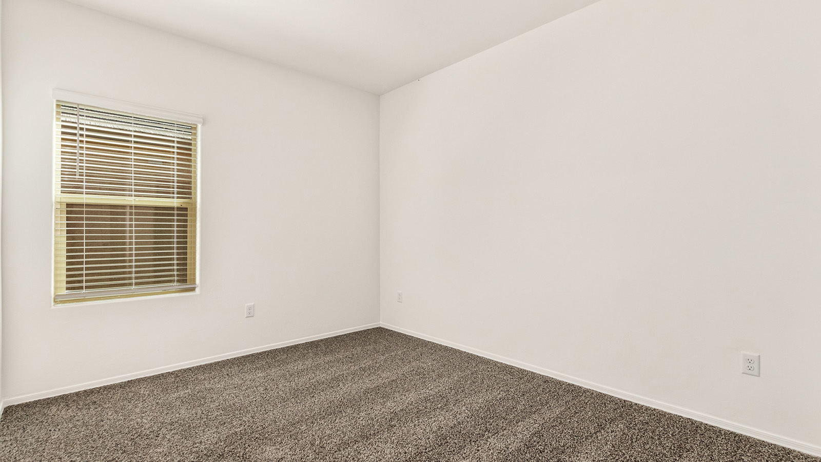 The Dalton at The Oasis at Rocking K presents an exceptional living experience that blends comfort and style within its thoughtfully crafted 1,569 square feet. This one-story, four-bedroom, two-bathroom home is designed to cater to a variety of lifestyle needs, offering both privacy and open spaces that encourage togetherness. As you step into the welcoming entryway, you're led into a spacious great room that seamlessly connects with the dining room and kitchen, creating a perfect setting for daily living and entertaining. The kitchen is a true culinary delight, featuring elegant quartz countertops, 42” shaker-style cabinets, and a modern layout that includes a pantry for additional storage.  The primary suite, located at the rear of the home, serves as a private oasis with a walk-in closet and a luxurious bathroom, complete with dual sinks and high-quality fixtures. The additional three bedrooms are positioned towards the front of the home, providing ample space for family, guests, or a home office setup. Each bedroom is well-proportioned, offering comfort and flexibility in their use.  The Dalton also features a covered patio, ideal for outdoor dining and relaxation, where you can enjoy the breathtaking views and Arizona sunsets that The Oasis at Rocking K is known for. The home includes a two-car garage, providing ample storage and parking space. Additionally, the front yard is meticulously landscaped with auto drip irrigation, ensuring your home’s curb appeal remains pristine year-round.  Living in The Oasis at Rocking K means enjoying a community filled with modern conveniences and natural beauty. Each home, including The Dalton, is equipped with D.R. Horton’s Home is Connected® Smart Home package, ensuring you have the latest in home automation technology. With additional energy-efficient features like spray foam insulation, a tankless water heater, and LED lighting, The Dalton is designed to offer long-term savings and environmental sustainability.  This home isn’t just a place to live; it’s part of a vibrant community where residents can take advantage of amenities such as walking trails, playgrounds, and community events that foster a strong sense of connection among neighbors. The Dalton at The Oasis at Rocking K isn’t just a house—it’s a home where memories are made and a fulfilling lifestyle awaits.