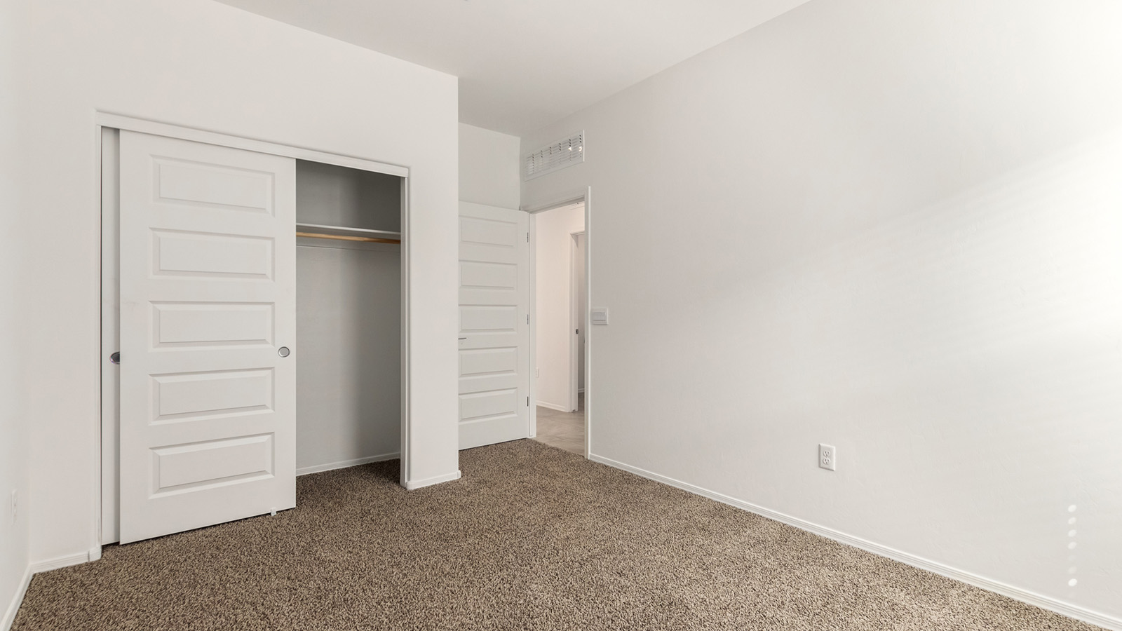 The Dalton at The Oasis at Rocking K presents an exceptional living experience that blends comfort and style within its thoughtfully crafted 1,569 square feet. This one-story, four-bedroom, two-bathroom home is designed to cater to a variety of lifestyle needs, offering both privacy and open spaces that encourage togetherness. As you step into the welcoming entryway, you're led into a spacious great room that seamlessly connects with the dining room and kitchen, creating a perfect setting for daily living and entertaining. The kitchen is a true culinary delight, featuring elegant quartz countertops, 42” shaker-style cabinets, and a modern layout that includes a pantry for additional storage.  The primary suite, located at the rear of the home, serves as a private oasis with a walk-in closet and a luxurious bathroom, complete with dual sinks and high-quality fixtures. The additional three bedrooms are positioned towards the front of the home, providing ample space for family, guests, or a home office setup. Each bedroom is well-proportioned, offering comfort and flexibility in their use.  The Dalton also features a covered patio, ideal for outdoor dining and relaxation, where you can enjoy the breathtaking views and Arizona sunsets that The Oasis at Rocking K is known for. The home includes a two-car garage, providing ample storage and parking space. Additionally, the front yard is meticulously landscaped with auto drip irrigation, ensuring your home’s curb appeal remains pristine year-round.  Living in The Oasis at Rocking K means enjoying a community filled with modern conveniences and natural beauty. Each home, including The Dalton, is equipped with D.R. Horton’s Home is Connected® Smart Home package, ensuring you have the latest in home automation technology. With additional energy-efficient features like spray foam insulation, a tankless water heater, and LED lighting, The Dalton is designed to offer long-term savings and environmental sustainability.  This home isn’t just a place to live; it’s part of a vibrant community where residents can take advantage of amenities such as walking trails, playgrounds, and community events that foster a strong sense of connection among neighbors. The Dalton at The Oasis at Rocking K isn’t just a house—it’s a home where memories are made and a fulfilling lifestyle awaits.