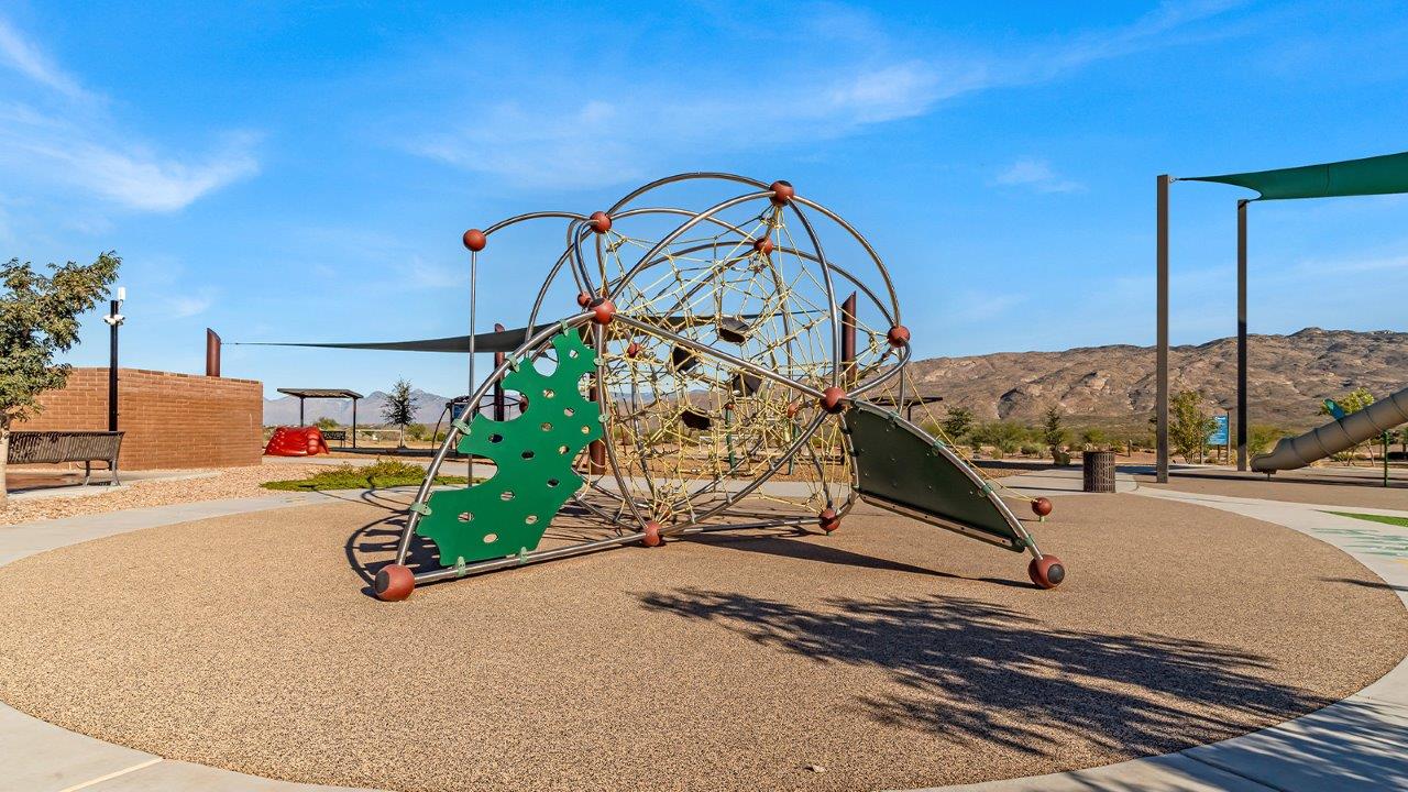 The Dalton at The Oasis at Rocking K presents an exceptional living experience that blends comfort and style within its thoughtfully crafted 1,569 square feet. This one-story, four-bedroom, two-bathroom home is designed to cater to a variety of lifestyle needs, offering both privacy and open spaces that encourage togetherness. As you step into the welcoming entryway, you're led into a spacious great room that seamlessly connects with the dining room and kitchen, creating a perfect setting for daily living and entertaining. The kitchen is a true culinary delight, featuring elegant quartz countertops, 42” shaker-style cabinets, and a modern layout that includes a pantry for additional storage.  The primary suite, located at the rear of the home, serves as a private oasis with a walk-in closet and a luxurious bathroom, complete with dual sinks and high-quality fixtures. The additional three bedrooms are positioned towards the front of the home, providing ample space for family, guests, or a home office setup. Each bedroom is well-proportioned, offering comfort and flexibility in their use.  The Dalton also features a covered patio, ideal for outdoor dining and relaxation, where you can enjoy the breathtaking views and Arizona sunsets that The Oasis at Rocking K is known for. The home includes a two-car garage, providing ample storage and parking space. Additionally, the front yard is meticulously landscaped with auto drip irrigation, ensuring your home’s curb appeal remains pristine year-round.  Living in The Oasis at Rocking K means enjoying a community filled with modern conveniences and natural beauty. Each home, including The Dalton, is equipped with D.R. Horton’s Home is Connected® Smart Home package, ensuring you have the latest in home automation technology. With additional energy-efficient features like spray foam insulation, a tankless water heater, and LED lighting, The Dalton is designed to offer long-term savings and environmental sustainability.  This home isn’t just a place to live; it’s part of a vibrant community where residents can take advantage of amenities such as walking trails, playgrounds, and community events that foster a strong sense of connection among neighbors. The Dalton at The Oasis at Rocking K isn’t just a house—it’s a home where memories are made and a fulfilling lifestyle awaits.