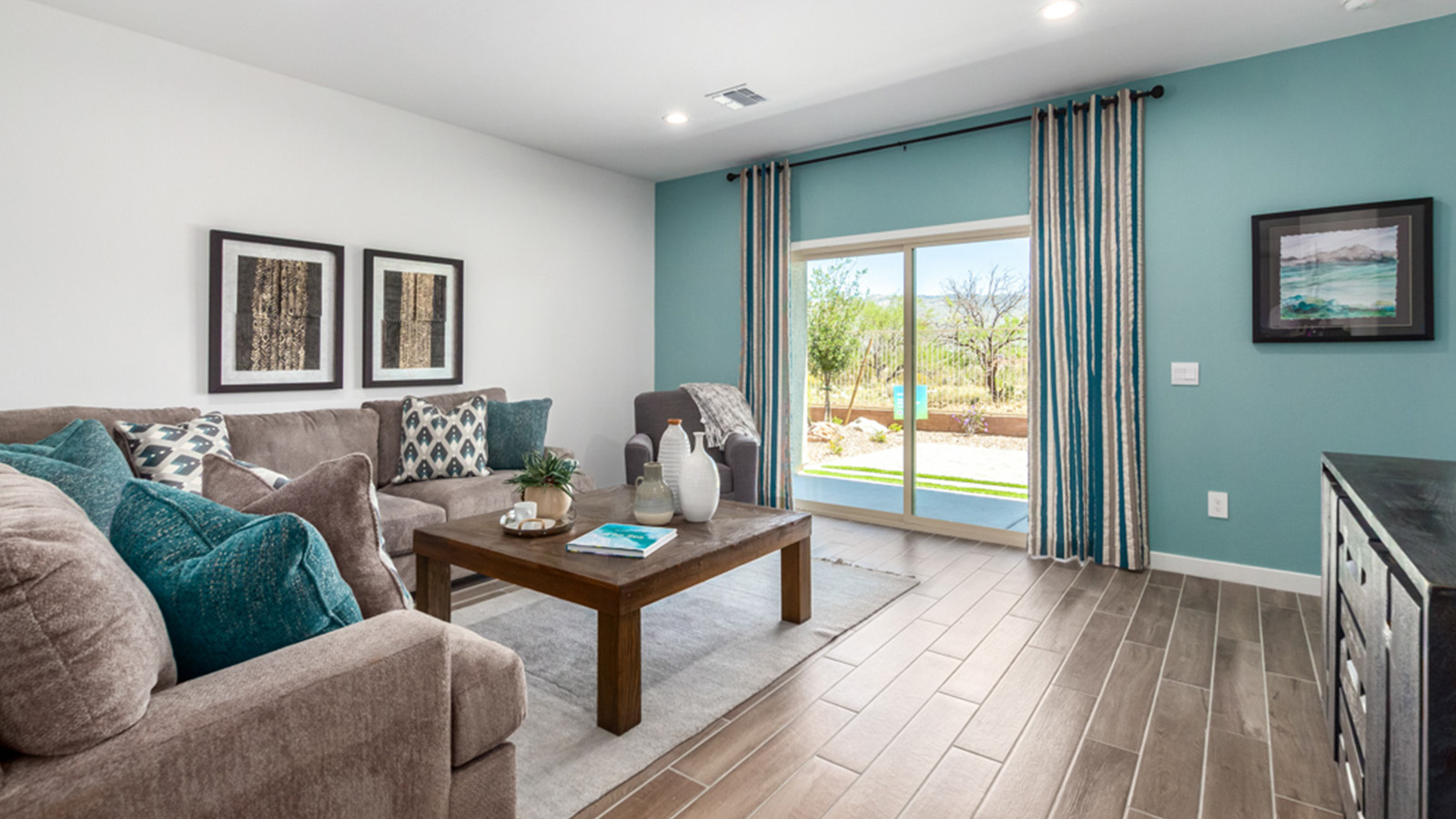 Welcome to The Gaven plan, a spacious single-story new home at The Oasis at Rocking K, where modern living meets the serene beauty of the Arizona landscape. This thoughtfully crafted residence offers 1,815 square feet of well-designed living space, featuring four bedrooms and two full bathrooms, perfect for families who value both comfort and style.  As you step through the front door, you’ll be greeted by a bright and airy entryway that seamlessly transitions into the heart of the home. The open layout connects the great room, dining area, and kitchen, creating an ideal environment for both everyday living and entertaining. The kitchen is a culinary haven, equipped with state-of-the-art appliances, a spacious pantry, and elegant quartz countertops that extend to a large island, perfect for meal prep or casual dining.  The primary suite, nestled at the rear of the home, offers a peaceful retreat with a generously sized walk-in closet and a luxurious en-suite bathroom. The additional three bedrooms are strategically placed to provide privacy and convenience, making them perfect for children, guests, or even a home office. Outside, the covered patio extends your living space, ideal for enjoying Arizona’s stunning sunsets. The front yard is fully landscaped and equipped with an auto drip irrigation system, ensuring your home’s curb appeal is maintained with ease.  Each home at The Oasis at Rocking K, including The Gaven plan, is outfitted with D.R. Horton’s Home is Connected® Smart Home package, featuring a smart thermostat, video doorbell, keyless entry, and Wi-Fi-enabled garage door opener. Energy efficiency is a cornerstone of the design, with features like spray foam insulation, tankless water heaters, and LED lighting, all contributing to long-term savings and environmental sustainability.  The Oasis at Rocking K isn’t just a place to live; it’s a vibrant community with a wealth of amenities, from scenic walking trails to sports courts and playgrounds, ensuring that there’s always something for everyone. Embrace the lifestyle you’ve always dreamed of in The Gaven plan—a perfect blend of comfort, convenience, and Arizona charm.  *Images shown are for reference only. They depict the Gaven model home and may not represent the actual home.