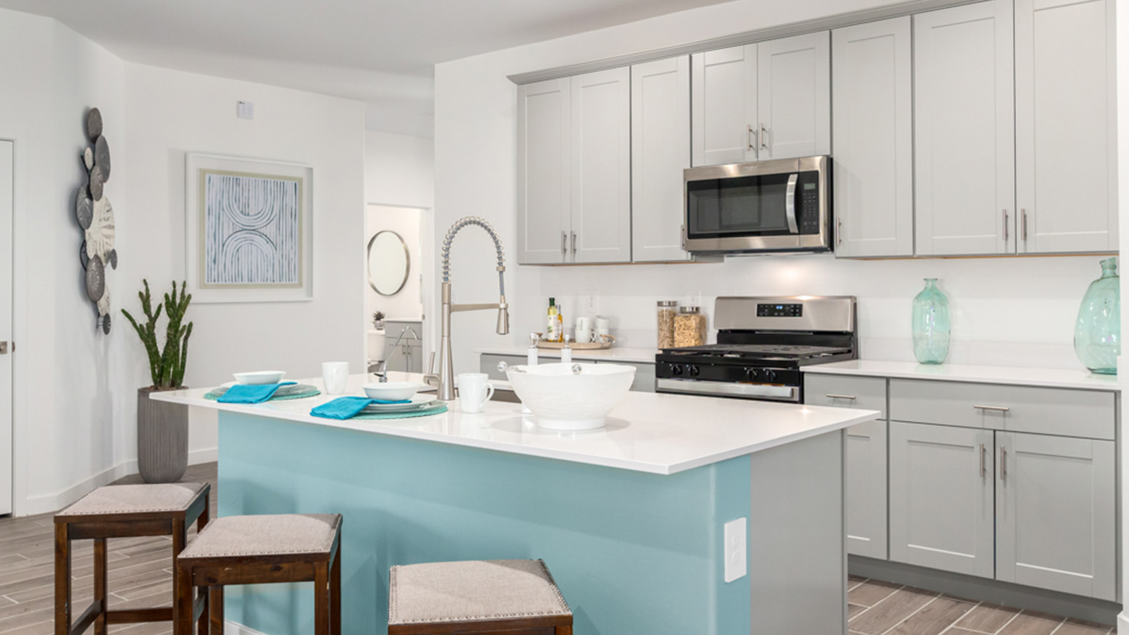 Welcome to The Gaven plan, a spacious single-story new home at The Oasis at Rocking K, where modern living meets the serene beauty of the Arizona landscape. This thoughtfully crafted residence offers 1,815 square feet of well-designed living space, featuring four bedrooms and two full bathrooms, perfect for families who value both comfort and style.  As you step through the front door, you’ll be greeted by a bright and airy entryway that seamlessly transitions into the heart of the home. The open layout connects the great room, dining area, and kitchen, creating an ideal environment for both everyday living and entertaining. The kitchen is a culinary haven, equipped with state-of-the-art appliances, a spacious pantry, and elegant quartz countertops that extend to a large island, perfect for meal prep or casual dining.  The primary suite, nestled at the rear of the home, offers a peaceful retreat with a generously sized walk-in closet and a luxurious en-suite bathroom. The additional three bedrooms are strategically placed to provide privacy and convenience, making them perfect for children, guests, or even a home office. Outside, the covered patio extends your living space, ideal for enjoying Arizona’s stunning sunsets. The front yard is fully landscaped and equipped with an auto drip irrigation system, ensuring your home’s curb appeal is maintained with ease.  Each home at The Oasis at Rocking K, including The Gaven plan, is outfitted with D.R. Horton’s Home is Connected® Smart Home package, featuring a smart thermostat, video doorbell, keyless entry, and Wi-Fi-enabled garage door opener. Energy efficiency is a cornerstone of the design, with features like spray foam insulation, tankless water heaters, and LED lighting, all contributing to long-term savings and environmental sustainability.  The Oasis at Rocking K isn’t just a place to live; it’s a vibrant community with a wealth of amenities, from scenic walking trails to sports courts and playgrounds, ensuring that there’s always something for everyone. Embrace the lifestyle you’ve always dreamed of in The Gaven plan—a perfect blend of comfort, convenience, and Arizona charm.  *Images shown are for reference only. They depict the Gaven model home and may not represent the actual home.