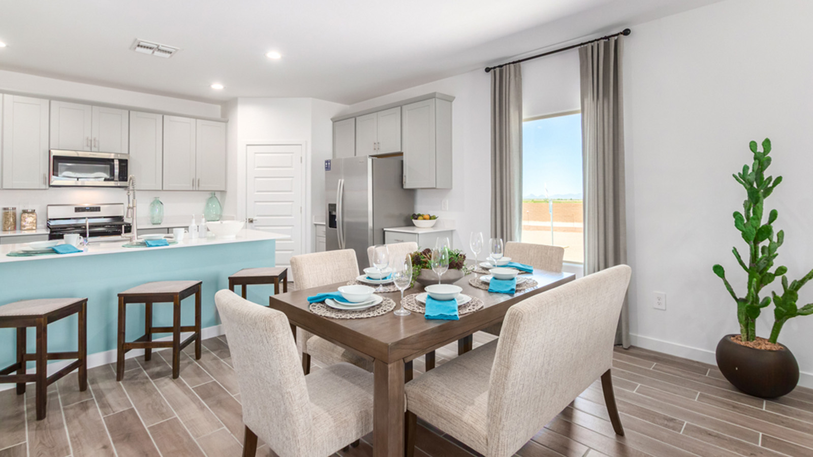 Welcome to The Gaven plan, a spacious single-story new home at The Oasis at Rocking K, where modern living meets the serene beauty of the Arizona landscape. This thoughtfully crafted residence offers 1,815 square feet of well-designed living space, featuring four bedrooms and two full bathrooms, perfect for families who value both comfort and style.  As you step through the front door, you’ll be greeted by a bright and airy entryway that seamlessly transitions into the heart of the home. The open layout connects the great room, dining area, and kitchen, creating an ideal environment for both everyday living and entertaining. The kitchen is a culinary haven, equipped with state-of-the-art appliances, a spacious pantry, and elegant quartz countertops that extend to a large island, perfect for meal prep or casual dining.  The primary suite, nestled at the rear of the home, offers a peaceful retreat with a generously sized walk-in closet and a luxurious en-suite bathroom. The additional three bedrooms are strategically placed to provide privacy and convenience, making them perfect for children, guests, or even a home office. Outside, the covered patio extends your living space, ideal for enjoying Arizona’s stunning sunsets. The front yard is fully landscaped and equipped with an auto drip irrigation system, ensuring your home’s curb appeal is maintained with ease.  Each home at The Oasis at Rocking K, including The Gaven plan, is outfitted with D.R. Horton’s Home is Connected® Smart Home package, featuring a smart thermostat, video doorbell, keyless entry, and Wi-Fi-enabled garage door opener. Energy efficiency is a cornerstone of the design, with features like spray foam insulation, tankless water heaters, and LED lighting, all contributing to long-term savings and environmental sustainability.  The Oasis at Rocking K isn’t just a place to live; it’s a vibrant community with a wealth of amenities, from scenic walking trails to sports courts and playgrounds, ensuring that there’s always something for everyone. Embrace the lifestyle you’ve always dreamed of in The Gaven plan—a perfect blend of comfort, convenience, and Arizona charm.  *Images shown are for reference only. They depict the Gaven model home and may not represent the actual home.