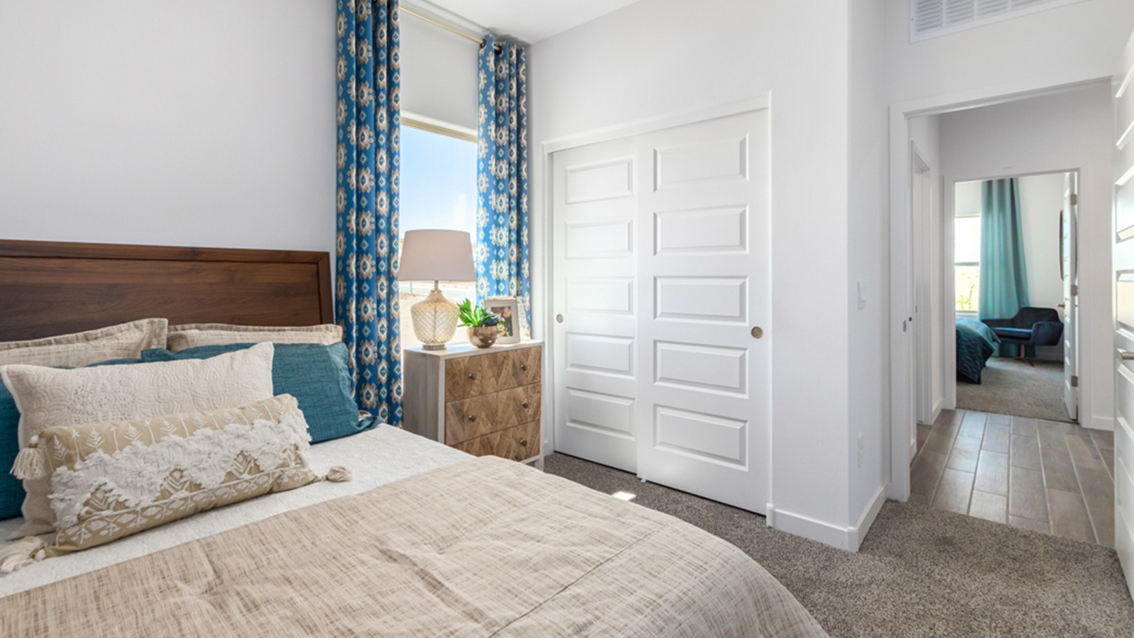 Welcome to The Gaven plan, a spacious single-story new home at The Oasis at Rocking K, where modern living meets the serene beauty of the Arizona landscape. This thoughtfully crafted residence offers 1,815 square feet of well-designed living space, featuring four bedrooms and two full bathrooms, perfect for families who value both comfort and style.  As you step through the front door, you’ll be greeted by a bright and airy entryway that seamlessly transitions into the heart of the home. The open layout connects the great room, dining area, and kitchen, creating an ideal environment for both everyday living and entertaining. The kitchen is a culinary haven, equipped with state-of-the-art appliances, a spacious pantry, and elegant quartz countertops that extend to a large island, perfect for meal prep or casual dining.  The primary suite, nestled at the rear of the home, offers a peaceful retreat with a generously sized walk-in closet and a luxurious en-suite bathroom. The additional three bedrooms are strategically placed to provide privacy and convenience, making them perfect for children, guests, or even a home office. Outside, the covered patio extends your living space, ideal for enjoying Arizona’s stunning sunsets. The front yard is fully landscaped and equipped with an auto drip irrigation system, ensuring your home’s curb appeal is maintained with ease.  Each home at The Oasis at Rocking K, including The Gaven plan, is outfitted with D.R. Horton’s Home is Connected® Smart Home package, featuring a smart thermostat, video doorbell, keyless entry, and Wi-Fi-enabled garage door opener. Energy efficiency is a cornerstone of the design, with features like spray foam insulation, tankless water heaters, and LED lighting, all contributing to long-term savings and environmental sustainability.  The Oasis at Rocking K isn’t just a place to live; it’s a vibrant community with a wealth of amenities, from scenic walking trails to sports courts and playgrounds, ensuring that there’s always something for everyone. Embrace the lifestyle you’ve always dreamed of in The Gaven plan—a perfect blend of comfort, convenience, and Arizona charm.  *Images shown are for reference only. They depict the Gaven model home and may not represent the actual home.