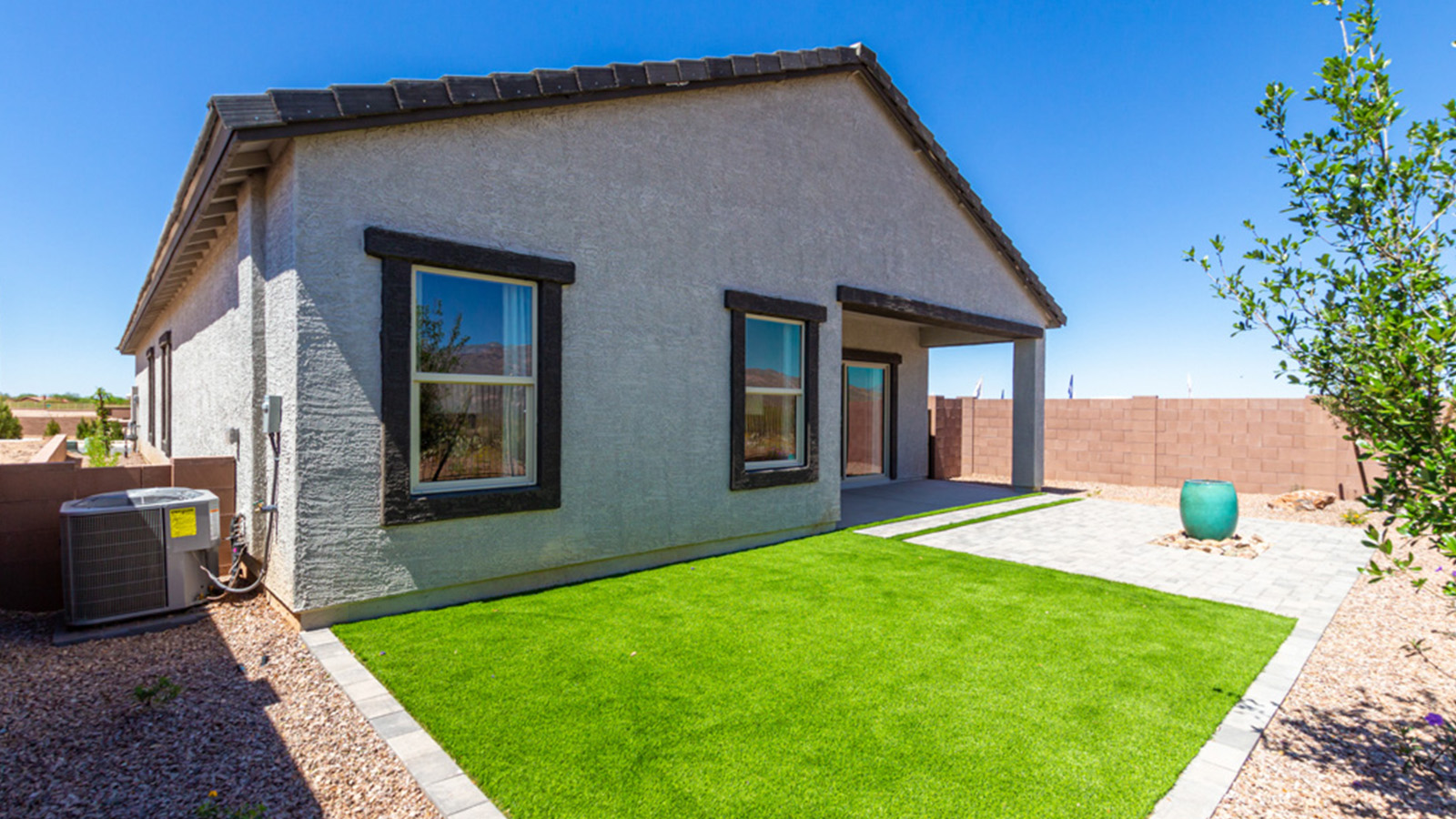 Welcome to The Gaven plan, a spacious single-story new home at The Oasis at Rocking K, where modern living meets the serene beauty of the Arizona landscape. This thoughtfully crafted residence offers 1,815 square feet of well-designed living space, featuring four bedrooms and two full bathrooms, perfect for families who value both comfort and style.  As you step through the front door, you’ll be greeted by a bright and airy entryway that seamlessly transitions into the heart of the home. The open layout connects the great room, dining area, and kitchen, creating an ideal environment for both everyday living and entertaining. The kitchen is a culinary haven, equipped with state-of-the-art appliances, a spacious pantry, and elegant quartz countertops that extend to a large island, perfect for meal prep or casual dining.  The primary suite, nestled at the rear of the home, offers a peaceful retreat with a generously sized walk-in closet and a luxurious en-suite bathroom. The additional three bedrooms are strategically placed to provide privacy and convenience, making them perfect for children, guests, or even a home office. Outside, the covered patio extends your living space, ideal for enjoying Arizona’s stunning sunsets. The front yard is fully landscaped and equipped with an auto drip irrigation system, ensuring your home’s curb appeal is maintained with ease.  Each home at The Oasis at Rocking K, including The Gaven plan, is outfitted with D.R. Horton’s Home is Connected® Smart Home package, featuring a smart thermostat, video doorbell, keyless entry, and Wi-Fi-enabled garage door opener. Energy efficiency is a cornerstone of the design, with features like spray foam insulation, tankless water heaters, and LED lighting, all contributing to long-term savings and environmental sustainability.  The Oasis at Rocking K isn’t just a place to live; it’s a vibrant community with a wealth of amenities, from scenic walking trails to sports courts and playgrounds, ensuring that there’s always something for everyone. Embrace the lifestyle you’ve always dreamed of in The Gaven plan—a perfect blend of comfort, convenience, and Arizona charm.  *Images shown are for reference only. They depict the Gaven model home and may not represent the actual home.