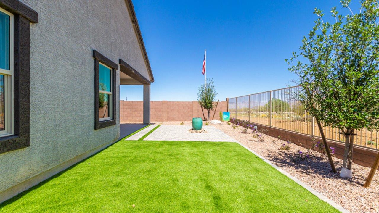 Welcome to The Gaven plan, a spacious single-story new home at The Oasis at Rocking K, where modern living meets the serene beauty of the Arizona landscape. This thoughtfully crafted residence offers 1,815 square feet of well-designed living space, featuring four bedrooms and two full bathrooms, perfect for families who value both comfort and style.  As you step through the front door, you’ll be greeted by a bright and airy entryway that seamlessly transitions into the heart of the home. The open layout connects the great room, dining area, and kitchen, creating an ideal environment for both everyday living and entertaining. The kitchen is a culinary haven, equipped with state-of-the-art appliances, a spacious pantry, and elegant quartz countertops that extend to a large island, perfect for meal prep or casual dining.  The primary suite, nestled at the rear of the home, offers a peaceful retreat with a generously sized walk-in closet and a luxurious en-suite bathroom. The additional three bedrooms are strategically placed to provide privacy and convenience, making them perfect for children, guests, or even a home office. Outside, the covered patio extends your living space, ideal for enjoying Arizona’s stunning sunsets. The front yard is fully landscaped and equipped with an auto drip irrigation system, ensuring your home’s curb appeal is maintained with ease.  Each home at The Oasis at Rocking K, including The Gaven plan, is outfitted with D.R. Horton’s Home is Connected® Smart Home package, featuring a smart thermostat, video doorbell, keyless entry, and Wi-Fi-enabled garage door opener. Energy efficiency is a cornerstone of the design, with features like spray foam insulation, tankless water heaters, and LED lighting, all contributing to long-term savings and environmental sustainability.  The Oasis at Rocking K isn’t just a place to live; it’s a vibrant community with a wealth of amenities, from scenic walking trails to sports courts and playgrounds, ensuring that there’s always something for everyone. Embrace the lifestyle you’ve always dreamed of in The Gaven plan—a perfect blend of comfort, convenience, and Arizona charm.  *Images shown are for reference only. They depict the Gaven model home and may not represent the actual home.