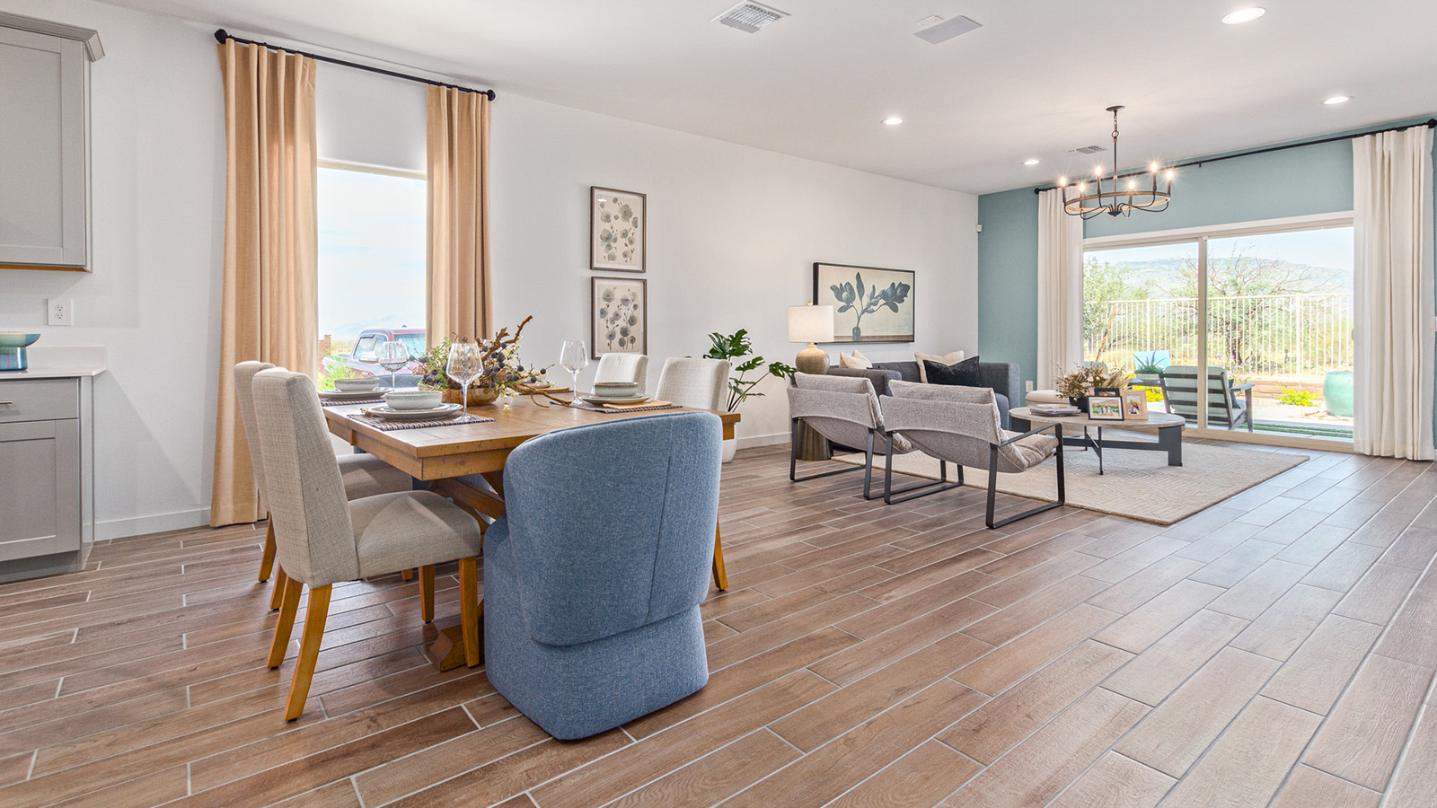 Welcome to The Gaven plan, a spacious single-story new home at The Oasis at Rocking K, where modern living meets the serene beauty of the Arizona landscape. This thoughtfully crafted residence offers 1,815 square feet of well-designed living space, featuring four bedrooms and two full bathrooms, perfect for families who value both comfort and style.  As you step through the front door, you’ll be greeted by a bright and airy entryway that seamlessly transitions into the heart of the home. The open layout connects the great room, dining area, and kitchen, creating an ideal environment for both everyday living and entertaining. The kitchen is a culinary haven, equipped with state-of-the-art appliances, a spacious pantry, and elegant quartz countertops that extend to a large island, perfect for meal prep or casual dining.  The primary suite, nestled at the rear of the home, offers a peaceful retreat with a generously sized walk-in closet and a luxurious en-suite bathroom. The additional three bedrooms are strategically placed to provide privacy and convenience, making them perfect for children, guests, or even a home office. Outside, the covered patio extends your living space, ideal for enjoying Arizona’s stunning sunsets. The front yard is fully landscaped and equipped with an auto drip irrigation system, ensuring your home’s curb appeal is maintained with ease.  Each home at The Oasis at Rocking K, including The Gaven plan, is outfitted with D.R. Horton’s Home is Connected® Smart Home package, featuring a smart thermostat, video doorbell, keyless entry, and Wi-Fi-enabled garage door opener. Energy efficiency is a cornerstone of the design, with features like spray foam insulation, tankless water heaters, and LED lighting, all contributing to long-term savings and environmental sustainability.  The Oasis at Rocking K isn’t just a place to live; it’s a vibrant community with a wealth of amenities, from scenic walking trails to sports courts and playgrounds, ensuring that there’s always something for everyone. Embrace the lifestyle you’ve always dreamed of in The Gaven plan—a perfect blend of comfort, convenience, and Arizona charm.