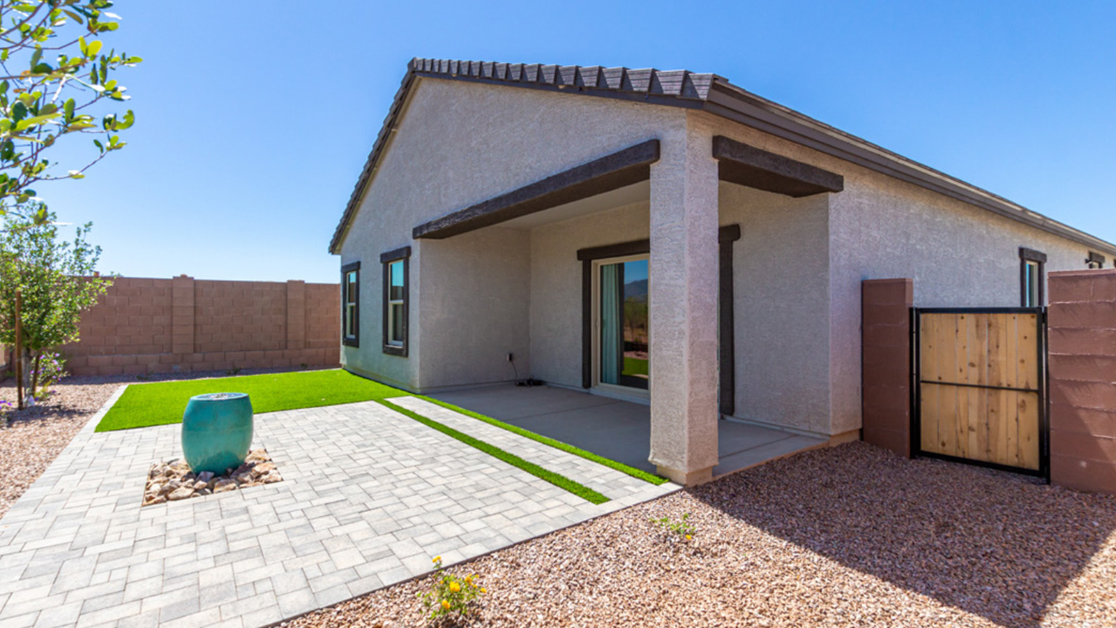 Welcome to The Gaven plan, a spacious single-story new home at The Oasis at Rocking K, where modern living meets the serene beauty of the Arizona landscape. This thoughtfully crafted residence offers 1,815 square feet of well-designed living space, featuring four bedrooms and two full bathrooms, perfect for families who value both comfort and style.  As you step through the front door, you’ll be greeted by a bright and airy entryway that seamlessly transitions into the heart of the home. The open layout connects the great room, dining area, and kitchen, creating an ideal environment for both everyday living and entertaining. The kitchen is a culinary haven, equipped with state-of-the-art appliances, a spacious pantry, and elegant quartz countertops that extend to a large island, perfect for meal prep or casual dining.  The primary suite, nestled at the rear of the home, offers a peaceful retreat with a generously sized walk-in closet and a luxurious en-suite bathroom. The additional three bedrooms are strategically placed to provide privacy and convenience, making them perfect for children, guests, or even a home office. Outside, the covered patio extends your living space, ideal for enjoying Arizona’s stunning sunsets. The front yard is fully landscaped and equipped with an auto drip irrigation system, ensuring your home’s curb appeal is maintained with ease.  Each home at The Oasis at Rocking K, including The Gaven plan, is outfitted with D.R. Horton’s Home is Connected® Smart Home package, featuring a smart thermostat, video doorbell, keyless entry, and Wi-Fi-enabled garage door opener. Energy efficiency is a cornerstone of the design, with features like spray foam insulation, tankless water heaters, and LED lighting, all contributing to long-term savings and environmental sustainability.  The Oasis at Rocking K isn’t just a place to live; it’s a vibrant community with a wealth of amenities, from scenic walking trails to sports courts and playgrounds, ensuring that there’s always something for everyone. Embrace the lifestyle you’ve always dreamed of in The Gaven plan—a perfect blend of comfort, convenience, and Arizona charm.
