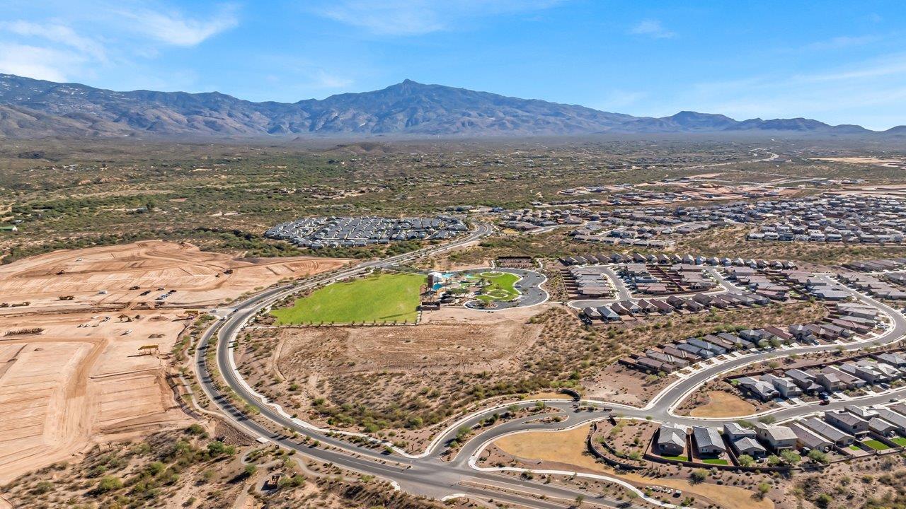 Welcome to The Gaven plan, a spacious single-story new home at The Oasis at Rocking K, where modern living meets the serene beauty of the Arizona landscape. This thoughtfully crafted residence offers 1,815 square feet of well-designed living space, featuring four bedrooms and two full bathrooms, perfect for families who value both comfort and style.  As you step through the front door, you’ll be greeted by a bright and airy entryway that seamlessly transitions into the heart of the home. The open layout connects the great room, dining area, and kitchen, creating an ideal environment for both everyday living and entertaining. The kitchen is a culinary haven, equipped with state-of-the-art appliances, a spacious pantry, and elegant quartz countertops that extend to a large island, perfect for meal prep or casual dining.  The primary suite, nestled at the rear of the home, offers a peaceful retreat with a generously sized walk-in closet and a luxurious en-suite bathroom. The additional three bedrooms are strategically placed to provide privacy and convenience, making them perfect for children, guests, or even a home office. Outside, the covered patio extends your living space, ideal for enjoying Arizona’s stunning sunsets. The front yard is fully landscaped and equipped with an auto drip irrigation system, ensuring your home’s curb appeal is maintained with ease.  Each home at The Oasis at Rocking K, including The Gaven plan, is outfitted with D.R. Horton’s Home is Connected® Smart Home package, featuring a smart thermostat, video doorbell, keyless entry, and Wi-Fi-enabled garage door opener. Energy efficiency is a cornerstone of the design, with features like spray foam insulation, tankless water heaters, and LED lighting, all contributing to long-term savings and environmental sustainability.  The Oasis at Rocking K isn’t just a place to live; it’s a vibrant community with a wealth of amenities, from scenic walking trails to sports courts and playgrounds, ensuring that there’s always something for everyone. Embrace the lifestyle you’ve always dreamed of in The Gaven plan—a perfect blend of comfort, convenience, and Arizona charm.