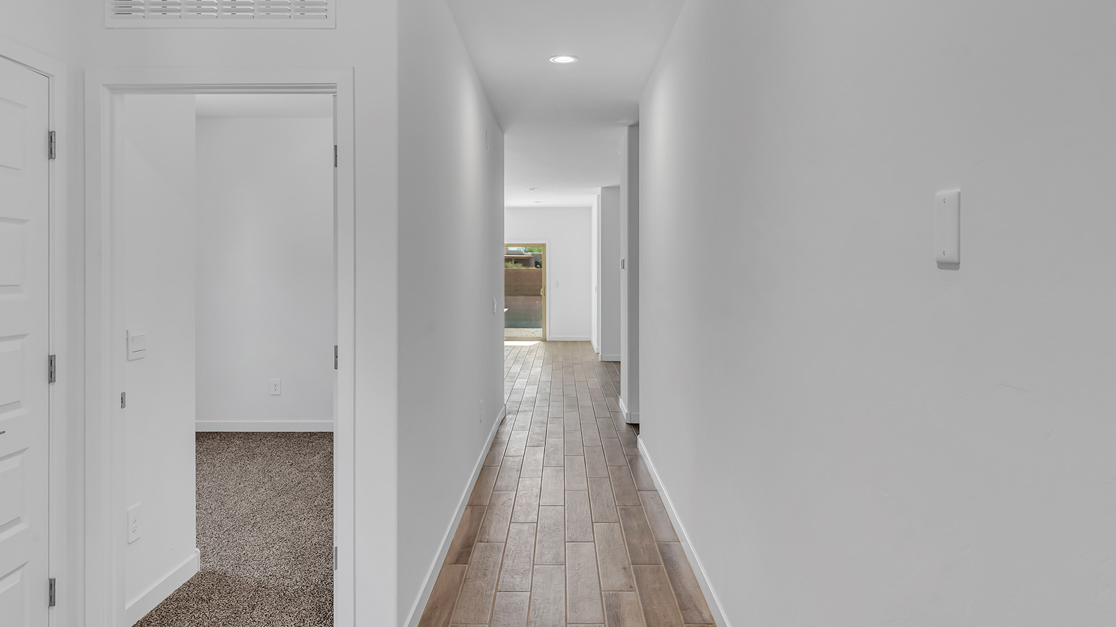 Discover The Harris, a beautifully designed new home at The Oasis at Rocking K, located in the serene surroundings of Vail, Arizona.  This charming one-story new home offers a seamless blend of style, functionality, and comfort, perfect for families and individuals alike. The Harris spans 1,856 square feet and includes four spacious bedrooms, two-and-a-half bathrooms, and a two-car garage, all meticulously crafted to meet the needs of modern living.  The exterior of The Harris offers three elevation options, each featuring D.R. Horton’s signature Spanish lace stucco, tile roofs, and professionally landscaped front yards with auto drip irrigation, adding to the home’s curb appeal. Inside, you’re greeted by an inviting foyer that leads to an open-concept living area, where the great room flows effortlessly into the dining area and a modern kitchen.  The kitchen is a chef's dream, equipped with top-of-the-line stainless steel appliances, quartz countertops, a large center island, and 42” shaker-style cabinets with stylish cabinet pulls. Adjacent to the kitchen, the dining area is perfect for family meals or entertaining guests. The great room, with its ample natural light and direct access to the covered patio, provides a perfect space for relaxation and gatherings.  The primary bedroom is a private sanctuary located at the back of the home, offering tranquility and easy access to the backyard. It features a walk-in closet and a luxurious en-suite bathroom with dual sinks and a large walk-in shower. The additional three bedrooms are generously sized, with two sharing a well-appointed full bathroom. A powder room, strategically placed near the living areas, adds convenience for guests.  Living at The Oasis at Rocking K means enjoying a variety of amenities, including ramadas, picnic areas, and access to the greater Rocking K master-planned community’s parks, walking trails, recreational facilities and events. Each home in this community also comes equipped with D.R. Horton’s Home is Connected® Smart Home package, offering the latest in modern living with features like a smart thermostat, video doorbell, and more.  Whether you’re looking for a home that offers space, style, or a sense of community, The Harris at The Oasis at Rocking K provides it all in a location that’s close to everything you need in Vail, Arizona.