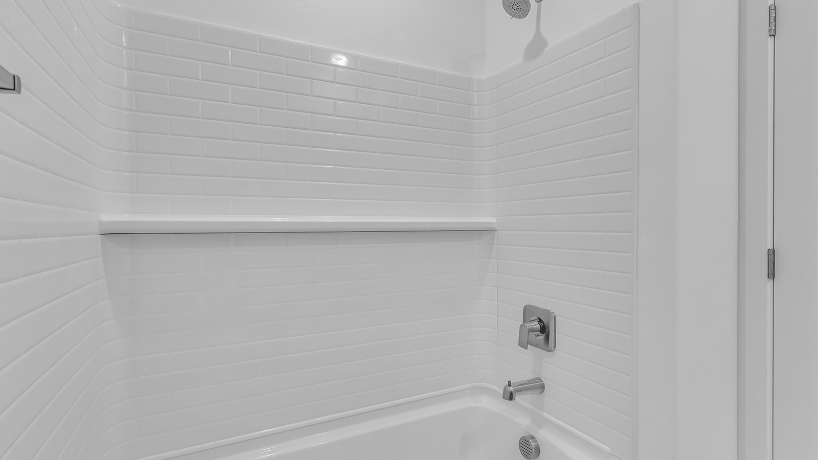 Discover The Harris, a beautifully designed new home at The Oasis at Rocking K, located in the serene surroundings of Vail, Arizona.  This charming one-story new home offers a seamless blend of style, functionality, and comfort, perfect for families and individuals alike. The Harris spans 1,856 square feet and includes four spacious bedrooms, two-and-a-half bathrooms, and a two-car garage, all meticulously crafted to meet the needs of modern living.  The exterior of The Harris offers three elevation options, each featuring D.R. Horton’s signature Spanish lace stucco, tile roofs, and professionally landscaped front yards with auto drip irrigation, adding to the home’s curb appeal. Inside, you’re greeted by an inviting foyer that leads to an open-concept living area, where the great room flows effortlessly into the dining area and a modern kitchen.  The kitchen is a chef's dream, equipped with top-of-the-line stainless steel appliances, quartz countertops, a large center island, and 42” shaker-style cabinets with stylish cabinet pulls. Adjacent to the kitchen, the dining area is perfect for family meals or entertaining guests. The great room, with its ample natural light and direct access to the covered patio, provides a perfect space for relaxation and gatherings.  The primary bedroom is a private sanctuary located at the back of the home, offering tranquility and easy access to the backyard. It features a walk-in closet and a luxurious en-suite bathroom with dual sinks and a large walk-in shower. The additional three bedrooms are generously sized, with two sharing a well-appointed full bathroom. A powder room, strategically placed near the living areas, adds convenience for guests.  Living at The Oasis at Rocking K means enjoying a variety of amenities, including ramadas, picnic areas, and access to the greater Rocking K master-planned community’s parks, walking trails, recreational facilities and events. Each home in this community also comes equipped with D.R. Horton’s Home is Connected® Smart Home package, offering the latest in modern living with features like a smart thermostat, video doorbell, and more.  Whether you’re looking for a home that offers space, style, or a sense of community, The Harris at The Oasis at Rocking K provides it all in a location that’s close to everything you need in Vail, Arizona.