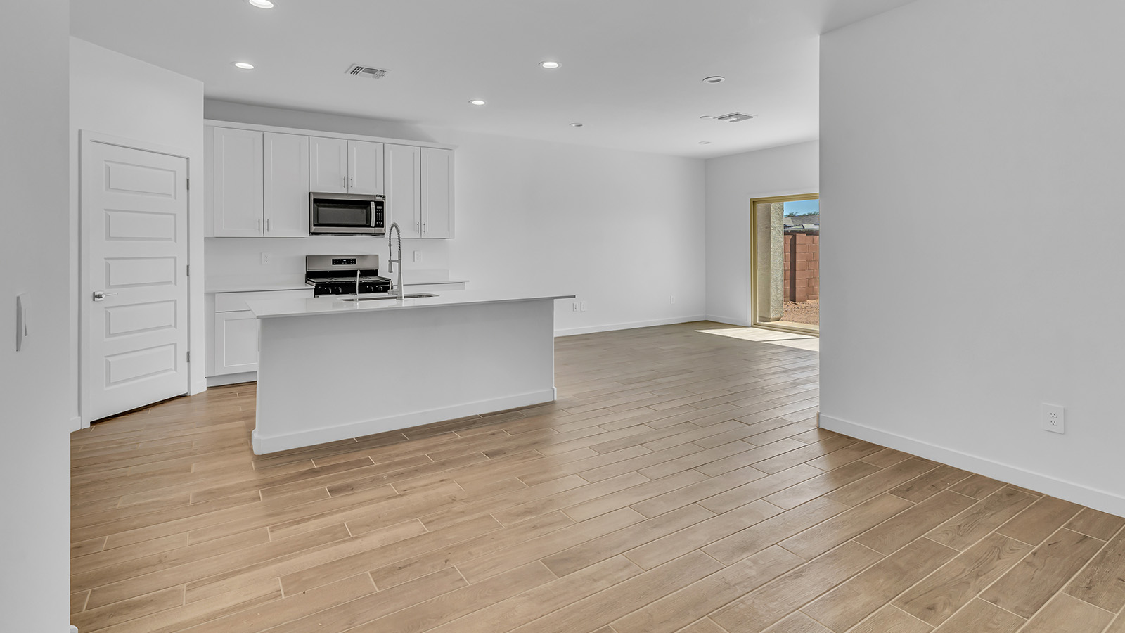 Discover The Harris, a beautifully designed new home at The Oasis at Rocking K, located in the serene surroundings of Vail, Arizona.  This charming one-story new home offers a seamless blend of style, functionality, and comfort, perfect for families and individuals alike. The Harris spans 1,856 square feet and includes four spacious bedrooms, two-and-a-half bathrooms, and a two-car garage, all meticulously crafted to meet the needs of modern living.  The exterior of The Harris offers three elevation options, each featuring D.R. Horton’s signature Spanish lace stucco, tile roofs, and professionally landscaped front yards with auto drip irrigation, adding to the home’s curb appeal. Inside, you’re greeted by an inviting foyer that leads to an open-concept living area, where the great room flows effortlessly into the dining area and a modern kitchen.  The kitchen is a chef's dream, equipped with top-of-the-line stainless steel appliances, quartz countertops, a large center island, and 42” shaker-style cabinets with stylish cabinet pulls. Adjacent to the kitchen, the dining area is perfect for family meals or entertaining guests. The great room, with its ample natural light and direct access to the covered patio, provides a perfect space for relaxation and gatherings.  The primary bedroom is a private sanctuary located at the back of the home, offering tranquility and easy access to the backyard. It features a walk-in closet and a luxurious en-suite bathroom with dual sinks and a large walk-in shower. The additional three bedrooms are generously sized, with two sharing a well-appointed full bathroom. A powder room, strategically placed near the living areas, adds convenience for guests.  Living at The Oasis at Rocking K means enjoying a variety of amenities, including ramadas, picnic areas, and access to the greater Rocking K master-planned community’s parks, walking trails, recreational facilities and events. Each home in this community also comes equipped with D.R. Horton’s Home is Connected® Smart Home package, offering the latest in modern living with features like a smart thermostat, video doorbell, and more.  Whether you’re looking for a home that offers space, style, or a sense of community, The Harris at The Oasis at Rocking K provides it all in a location that’s close to everything you need in Vail, Arizona.