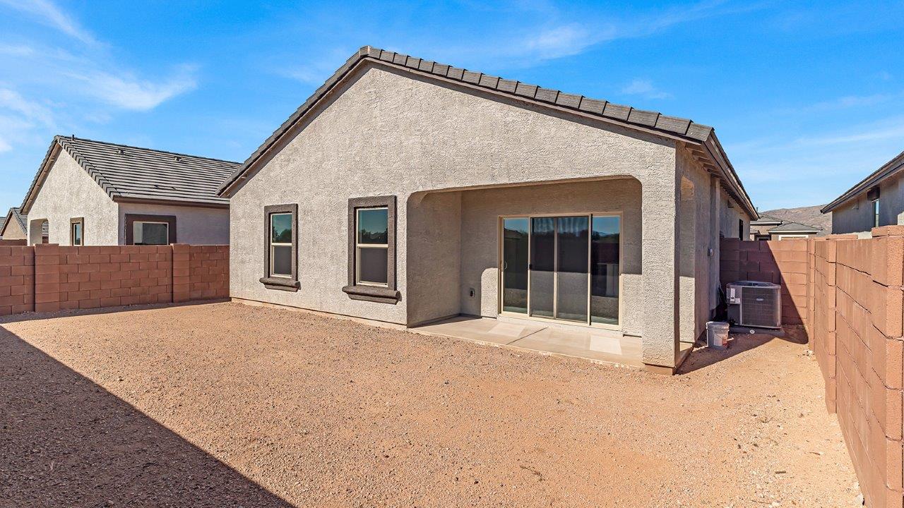 Discover The Harris, a beautifully designed new home at The Oasis at Rocking K, located in the serene surroundings of Vail, Arizona.  This charming one-story new home offers a seamless blend of style, functionality, and comfort, perfect for families and individuals alike. The Harris spans 1,856 square feet and includes four spacious bedrooms, two-and-a-half bathrooms, and a two-car garage, all meticulously crafted to meet the needs of modern living.  The exterior of The Harris offers three elevation options, each featuring D.R. Horton’s signature Spanish lace stucco, tile roofs, and professionally landscaped front yards with auto drip irrigation, adding to the home’s curb appeal. Inside, you’re greeted by an inviting foyer that leads to an open-concept living area, where the great room flows effortlessly into the dining area and a modern kitchen.  The kitchen is a chef's dream, equipped with top-of-the-line stainless steel appliances, quartz countertops, a large center island, and 42” shaker-style cabinets with stylish cabinet pulls. Adjacent to the kitchen, the dining area is perfect for family meals or entertaining guests. The great room, with its ample natural light and direct access to the covered patio, provides a perfect space for relaxation and gatherings.  The primary bedroom is a private sanctuary located at the back of the home, offering tranquility and easy access to the backyard. It features a walk-in closet and a luxurious en-suite bathroom with dual sinks and a large walk-in shower. The additional three bedrooms are generously sized, with two sharing a well-appointed full bathroom. A powder room, strategically placed near the living areas, adds convenience for guests.  Living at The Oasis at Rocking K means enjoying a variety of amenities, including ramadas, picnic areas, and access to the greater Rocking K master-planned community’s parks, walking trails, recreational facilities and events. Each home in this community also comes equipped with D.R. Horton’s Home is Connected® Smart Home package, offering the latest in modern living with features like a smart thermostat, video doorbell, and more.  Whether you’re looking for a home that offers space, style, or a sense of community, The Harris at The Oasis at Rocking K provides it all in a location that’s close to everything you need in Vail, Arizona.