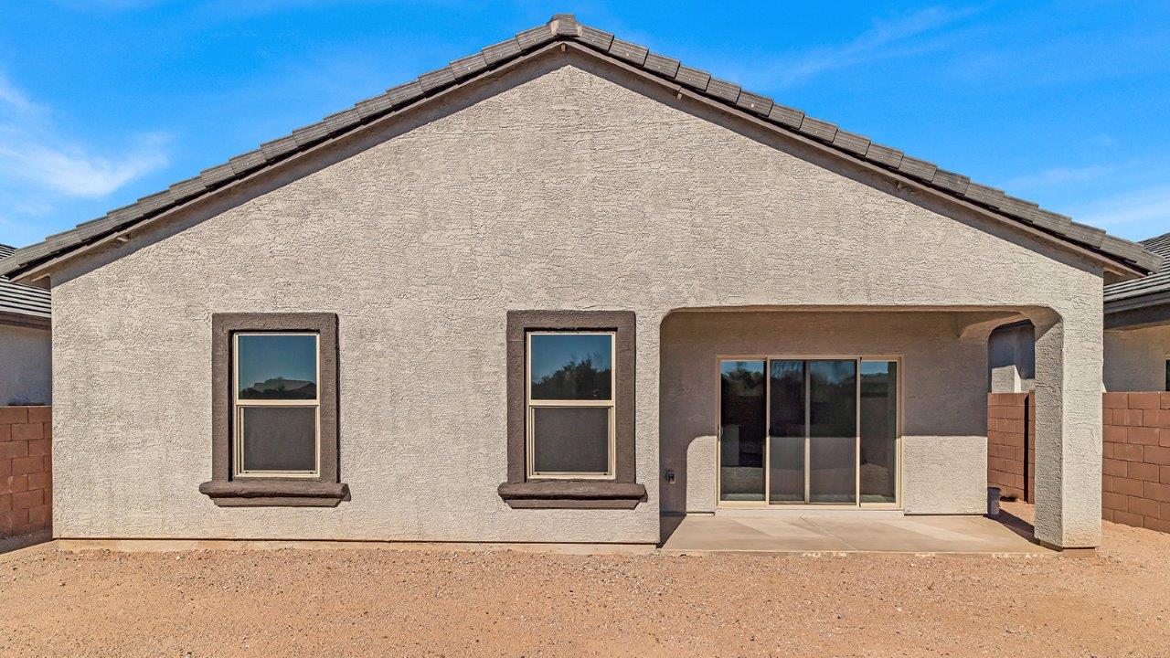 Discover The Harris, a beautifully designed new home at The Oasis at Rocking K, located in the serene surroundings of Vail, Arizona.  This charming one-story new home offers a seamless blend of style, functionality, and comfort, perfect for families and individuals alike. The Harris spans 1,856 square feet and includes four spacious bedrooms, two-and-a-half bathrooms, and a two-car garage, all meticulously crafted to meet the needs of modern living.  The exterior of The Harris offers three elevation options, each featuring D.R. Horton’s signature Spanish lace stucco, tile roofs, and professionally landscaped front yards with auto drip irrigation, adding to the home’s curb appeal. Inside, you’re greeted by an inviting foyer that leads to an open-concept living area, where the great room flows effortlessly into the dining area and a modern kitchen.  The kitchen is a chef's dream, equipped with top-of-the-line stainless steel appliances, quartz countertops, a large center island, and 42” shaker-style cabinets with stylish cabinet pulls. Adjacent to the kitchen, the dining area is perfect for family meals or entertaining guests. The great room, with its ample natural light and direct access to the covered patio, provides a perfect space for relaxation and gatherings.  The primary bedroom is a private sanctuary located at the back of the home, offering tranquility and easy access to the backyard. It features a walk-in closet and a luxurious en-suite bathroom with dual sinks and a large walk-in shower. The additional three bedrooms are generously sized, with two sharing a well-appointed full bathroom. A powder room, strategically placed near the living areas, adds convenience for guests.  Living at The Oasis at Rocking K means enjoying a variety of amenities, including ramadas, picnic areas, and access to the greater Rocking K master-planned community’s parks, walking trails, recreational facilities and events. Each home in this community also comes equipped with D.R. Horton’s Home is Connected® Smart Home package, offering the latest in modern living with features like a smart thermostat, video doorbell, and more.  Whether you’re looking for a home that offers space, style, or a sense of community, The Harris at The Oasis at Rocking K provides it all in a location that’s close to everything you need in Vail, Arizona.