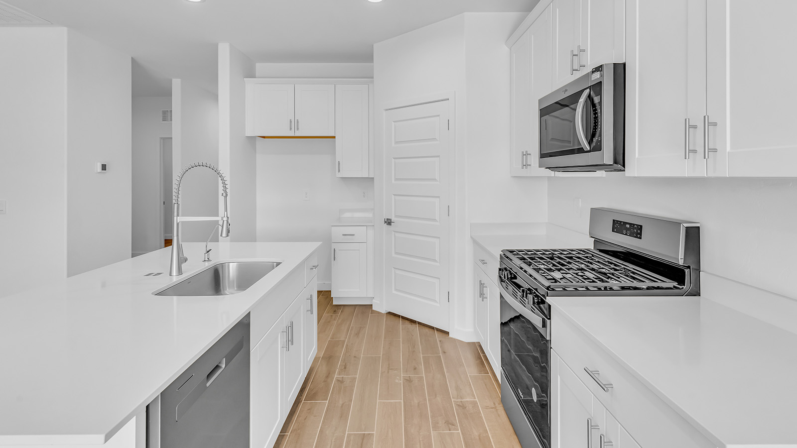 Discover The Harris, a beautifully designed new home at The Oasis at Rocking K, located in the serene surroundings of Vail, Arizona.  This charming one-story new home offers a seamless blend of style, functionality, and comfort, perfect for families and individuals alike. The Harris spans 1,856 square feet and includes four spacious bedrooms, two-and-a-half bathrooms, and a two-car garage, all meticulously crafted to meet the needs of modern living.  The exterior of The Harris offers three elevation options, each featuring D.R. Horton’s signature Spanish lace stucco, tile roofs, and professionally landscaped front yards with auto drip irrigation, adding to the home’s curb appeal. Inside, you’re greeted by an inviting foyer that leads to an open-concept living area, where the great room flows effortlessly into the dining area and a modern kitchen.  The kitchen is a chef's dream, equipped with top-of-the-line stainless steel appliances, quartz countertops, a large center island, and 42” shaker-style cabinets with stylish cabinet pulls. Adjacent to the kitchen, the dining area is perfect for family meals or entertaining guests. The great room, with its ample natural light and direct access to the covered patio, provides a perfect space for relaxation and gatherings.  The primary bedroom is a private sanctuary located at the back of the home, offering tranquility and easy access to the backyard. It features a walk-in closet and a luxurious en-suite bathroom with dual sinks and a large walk-in shower. The additional three bedrooms are generously sized, with two sharing a well-appointed full bathroom. A powder room, strategically placed near the living areas, adds convenience for guests.  Living at The Oasis at Rocking K means enjoying a variety of amenities, including ramadas, picnic areas, and access to the greater Rocking K master-planned community’s parks, walking trails, recreational facilities and events. Each home in this community also comes equipped with D.R. Horton’s Home is Connected® Smart Home package, offering the latest in modern living with features like a smart thermostat, video doorbell, and more.  Whether you’re looking for a home that offers space, style, or a sense of community, The Harris at The Oasis at Rocking K provides it all in a location that’s close to everything you need in Vail, Arizona.