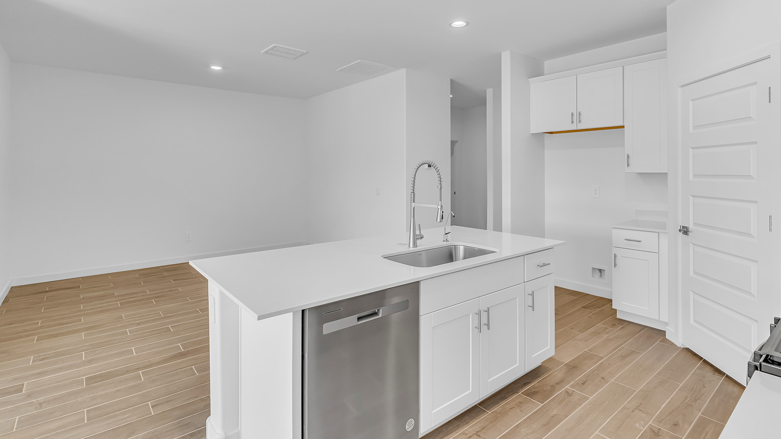 Discover The Harris, a beautifully designed new home at The Oasis at Rocking K, located in the serene surroundings of Vail, Arizona.  This charming one-story new home offers a seamless blend of style, functionality, and comfort, perfect for families and individuals alike. The Harris spans 1,856 square feet and includes four spacious bedrooms, two-and-a-half bathrooms, and a two-car garage, all meticulously crafted to meet the needs of modern living.  The exterior of The Harris offers three elevation options, each featuring D.R. Horton’s signature Spanish lace stucco, tile roofs, and professionally landscaped front yards with auto drip irrigation, adding to the home’s curb appeal. Inside, you’re greeted by an inviting foyer that leads to an open-concept living area, where the great room flows effortlessly into the dining area and a modern kitchen.  The kitchen is a chef's dream, equipped with top-of-the-line stainless steel appliances, quartz countertops, a large center island, and 42” shaker-style cabinets with stylish cabinet pulls. Adjacent to the kitchen, the dining area is perfect for family meals or entertaining guests. The great room, with its ample natural light and direct access to the covered patio, provides a perfect space for relaxation and gatherings.  The primary bedroom is a private sanctuary located at the back of the home, offering tranquility and easy access to the backyard. It features a walk-in closet and a luxurious en-suite bathroom with dual sinks and a large walk-in shower. The additional three bedrooms are generously sized, with two sharing a well-appointed full bathroom. A powder room, strategically placed near the living areas, adds convenience for guests.  Living at The Oasis at Rocking K means enjoying a variety of amenities, including ramadas, picnic areas, and access to the greater Rocking K master-planned community’s parks, walking trails, recreational facilities and events. Each home in this community also comes equipped with D.R. Horton’s Home is Connected® Smart Home package, offering the latest in modern living with features like a smart thermostat, video doorbell, and more.  Whether you’re looking for a home that offers space, style, or a sense of community, The Harris at The Oasis at Rocking K provides it all in a location that’s close to everything you need in Vail, Arizona.