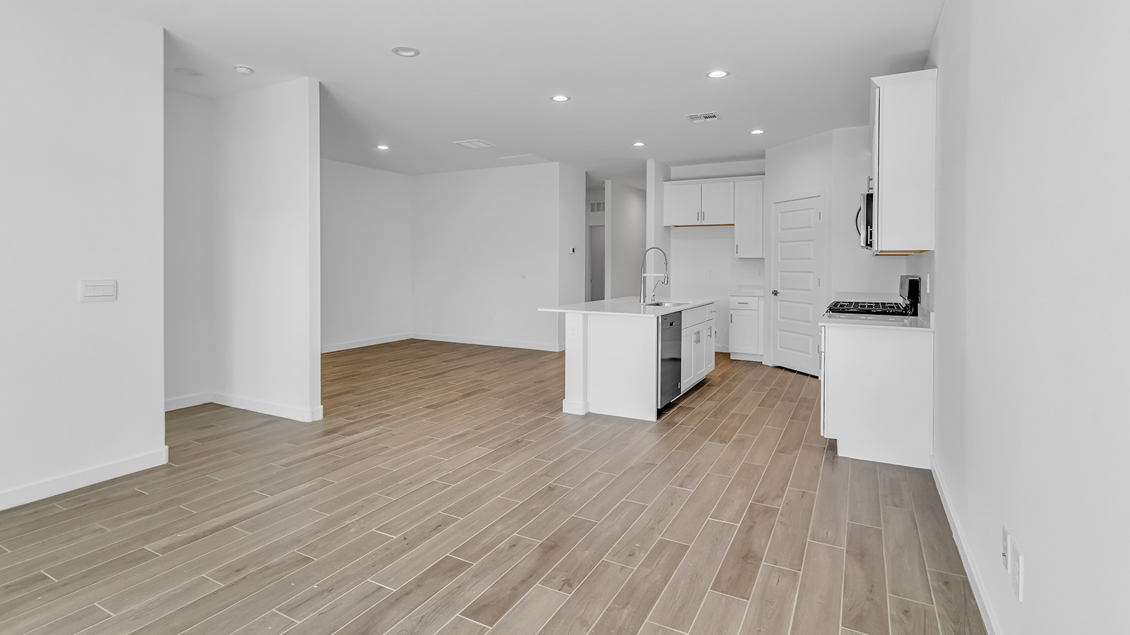 Discover The Harris, a beautifully designed new home at The Oasis at Rocking K, located in the serene surroundings of Vail, Arizona.  This charming one-story new home offers a seamless blend of style, functionality, and comfort, perfect for families and individuals alike. The Harris spans 1,856 square feet and includes four spacious bedrooms, two-and-a-half bathrooms, and a two-car garage, all meticulously crafted to meet the needs of modern living.  The exterior of The Harris offers three elevation options, each featuring D.R. Horton’s signature Spanish lace stucco, tile roofs, and professionally landscaped front yards with auto drip irrigation, adding to the home’s curb appeal. Inside, you’re greeted by an inviting foyer that leads to an open-concept living area, where the great room flows effortlessly into the dining area and a modern kitchen.  The kitchen is a chef's dream, equipped with top-of-the-line stainless steel appliances, quartz countertops, a large center island, and 42” shaker-style cabinets with stylish cabinet pulls. Adjacent to the kitchen, the dining area is perfect for family meals or entertaining guests. The great room, with its ample natural light and direct access to the covered patio, provides a perfect space for relaxation and gatherings.  The primary bedroom is a private sanctuary located at the back of the home, offering tranquility and easy access to the backyard. It features a walk-in closet and a luxurious en-suite bathroom with dual sinks and a large walk-in shower. The additional three bedrooms are generously sized, with two sharing a well-appointed full bathroom. A powder room, strategically placed near the living areas, adds convenience for guests.  Living at The Oasis at Rocking K means enjoying a variety of amenities, including ramadas, picnic areas, and access to the greater Rocking K master-planned community’s parks, walking trails, recreational facilities and events. Each home in this community also comes equipped with D.R. Horton’s Home is Connected® Smart Home package, offering the latest in modern living with features like a smart thermostat, video doorbell, and more.  Whether you’re looking for a home that offers space, style, or a sense of community, The Harris at The Oasis at Rocking K provides it all in a location that’s close to everything you need in Vail, Arizona.