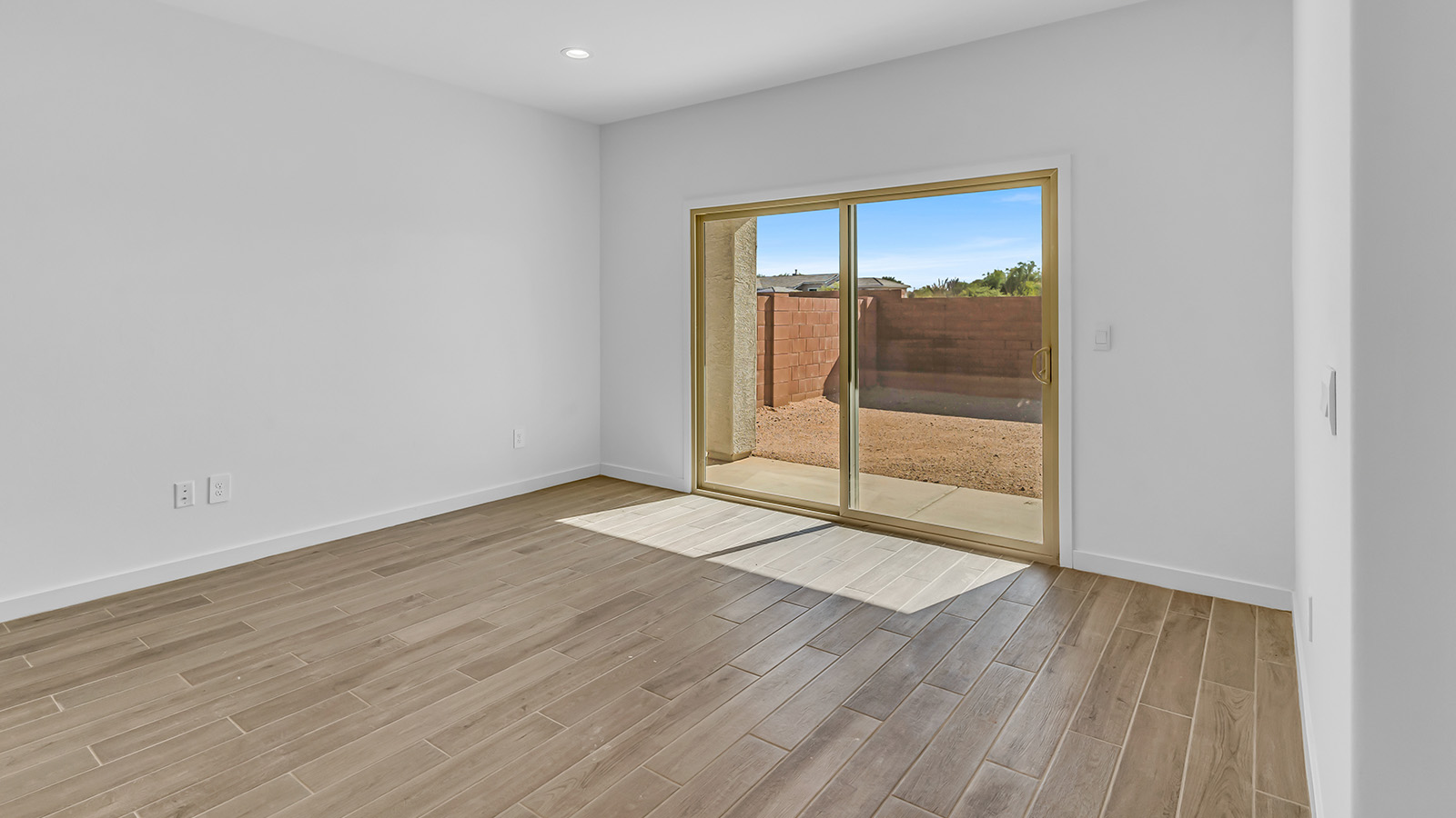 Discover The Harris, a beautifully designed new home at The Oasis at Rocking K, located in the serene surroundings of Vail, Arizona.  This charming one-story new home offers a seamless blend of style, functionality, and comfort, perfect for families and individuals alike. The Harris spans 1,856 square feet and includes four spacious bedrooms, two-and-a-half bathrooms, and a two-car garage, all meticulously crafted to meet the needs of modern living.  The exterior of The Harris offers three elevation options, each featuring D.R. Horton’s signature Spanish lace stucco, tile roofs, and professionally landscaped front yards with auto drip irrigation, adding to the home’s curb appeal. Inside, you’re greeted by an inviting foyer that leads to an open-concept living area, where the great room flows effortlessly into the dining area and a modern kitchen.  The kitchen is a chef's dream, equipped with top-of-the-line stainless steel appliances, quartz countertops, a large center island, and 42” shaker-style cabinets with stylish cabinet pulls. Adjacent to the kitchen, the dining area is perfect for family meals or entertaining guests. The great room, with its ample natural light and direct access to the covered patio, provides a perfect space for relaxation and gatherings.  The primary bedroom is a private sanctuary located at the back of the home, offering tranquility and easy access to the backyard. It features a walk-in closet and a luxurious en-suite bathroom with dual sinks and a large walk-in shower. The additional three bedrooms are generously sized, with two sharing a well-appointed full bathroom. A powder room, strategically placed near the living areas, adds convenience for guests.  Living at The Oasis at Rocking K means enjoying a variety of amenities, including ramadas, picnic areas, and access to the greater Rocking K master-planned community’s parks, walking trails, recreational facilities and events. Each home in this community also comes equipped with D.R. Horton’s Home is Connected® Smart Home package, offering the latest in modern living with features like a smart thermostat, video doorbell, and more.  Whether you’re looking for a home that offers space, style, or a sense of community, The Harris at The Oasis at Rocking K provides it all in a location that’s close to everything you need in Vail, Arizona.