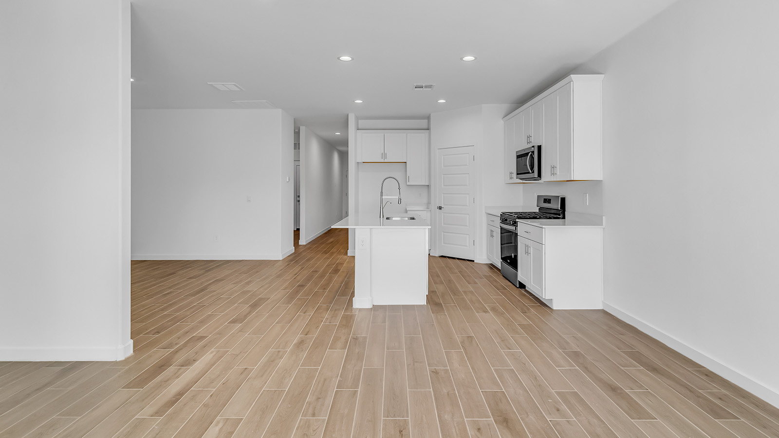 Discover The Harris, a beautifully designed new home at The Oasis at Rocking K, located in the serene surroundings of Vail, Arizona.  This charming one-story new home offers a seamless blend of style, functionality, and comfort, perfect for families and individuals alike. The Harris spans 1,856 square feet and includes four spacious bedrooms, two-and-a-half bathrooms, and a two-car garage, all meticulously crafted to meet the needs of modern living.  The exterior of The Harris offers three elevation options, each featuring D.R. Horton’s signature Spanish lace stucco, tile roofs, and professionally landscaped front yards with auto drip irrigation, adding to the home’s curb appeal. Inside, you’re greeted by an inviting foyer that leads to an open-concept living area, where the great room flows effortlessly into the dining area and a modern kitchen.  The kitchen is a chef's dream, equipped with top-of-the-line stainless steel appliances, quartz countertops, a large center island, and 42” shaker-style cabinets with stylish cabinet pulls. Adjacent to the kitchen, the dining area is perfect for family meals or entertaining guests. The great room, with its ample natural light and direct access to the covered patio, provides a perfect space for relaxation and gatherings.  The primary bedroom is a private sanctuary located at the back of the home, offering tranquility and easy access to the backyard. It features a walk-in closet and a luxurious en-suite bathroom with dual sinks and a large walk-in shower. The additional three bedrooms are generously sized, with two sharing a well-appointed full bathroom. A powder room, strategically placed near the living areas, adds convenience for guests.  Living at The Oasis at Rocking K means enjoying a variety of amenities, including ramadas, picnic areas, and access to the greater Rocking K master-planned community’s parks, walking trails, recreational facilities and events. Each home in this community also comes equipped with D.R. Horton’s Home is Connected® Smart Home package, offering the latest in modern living with features like a smart thermostat, video doorbell, and more.  Whether you’re looking for a home that offers space, style, or a sense of community, The Harris at The Oasis at Rocking K provides it all in a location that’s close to everything you need in Vail, Arizona.