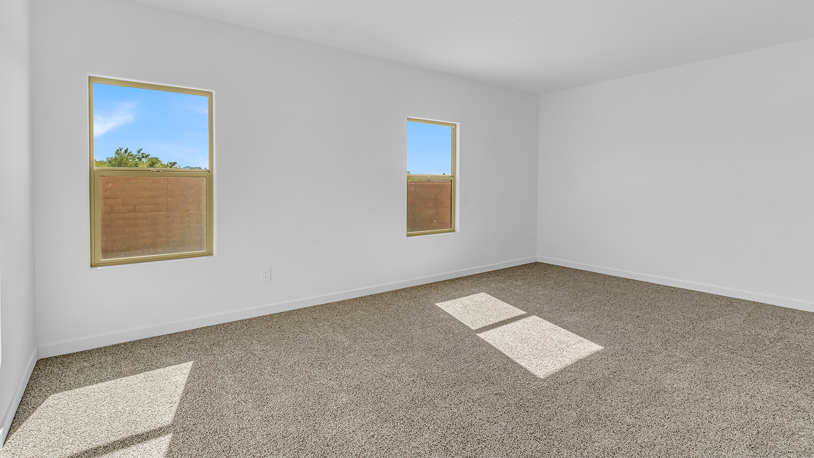 Discover The Harris, a beautifully designed new home at The Oasis at Rocking K, located in the serene surroundings of Vail, Arizona.  This charming one-story new home offers a seamless blend of style, functionality, and comfort, perfect for families and individuals alike. The Harris spans 1,856 square feet and includes four spacious bedrooms, two-and-a-half bathrooms, and a two-car garage, all meticulously crafted to meet the needs of modern living.  The exterior of The Harris offers three elevation options, each featuring D.R. Horton’s signature Spanish lace stucco, tile roofs, and professionally landscaped front yards with auto drip irrigation, adding to the home’s curb appeal. Inside, you’re greeted by an inviting foyer that leads to an open-concept living area, where the great room flows effortlessly into the dining area and a modern kitchen.  The kitchen is a chef's dream, equipped with top-of-the-line stainless steel appliances, quartz countertops, a large center island, and 42” shaker-style cabinets with stylish cabinet pulls. Adjacent to the kitchen, the dining area is perfect for family meals or entertaining guests. The great room, with its ample natural light and direct access to the covered patio, provides a perfect space for relaxation and gatherings.  The primary bedroom is a private sanctuary located at the back of the home, offering tranquility and easy access to the backyard. It features a walk-in closet and a luxurious en-suite bathroom with dual sinks and a large walk-in shower. The additional three bedrooms are generously sized, with two sharing a well-appointed full bathroom. A powder room, strategically placed near the living areas, adds convenience for guests.  Living at The Oasis at Rocking K means enjoying a variety of amenities, including ramadas, picnic areas, and access to the greater Rocking K master-planned community’s parks, walking trails, recreational facilities and events. Each home in this community also comes equipped with D.R. Horton’s Home is Connected® Smart Home package, offering the latest in modern living with features like a smart thermostat, video doorbell, and more.  Whether you’re looking for a home that offers space, style, or a sense of community, The Harris at The Oasis at Rocking K provides it all in a location that’s close to everything you need in Vail, Arizona.