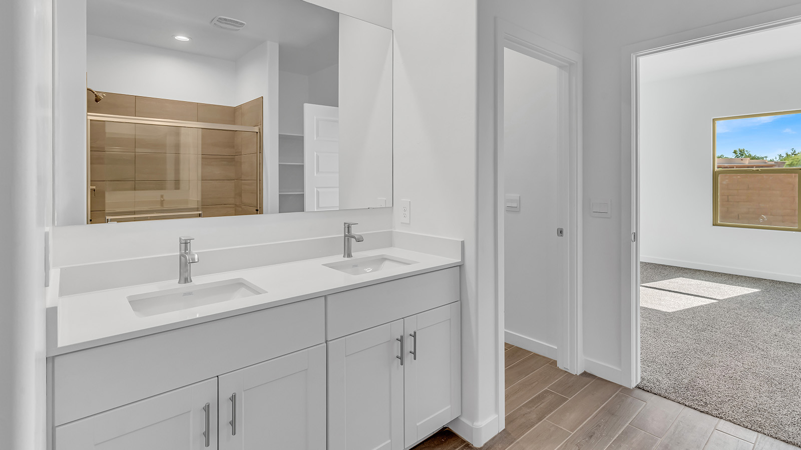 Discover The Harris, a beautifully designed new home at The Oasis at Rocking K, located in the serene surroundings of Vail, Arizona.  This charming one-story new home offers a seamless blend of style, functionality, and comfort, perfect for families and individuals alike. The Harris spans 1,856 square feet and includes four spacious bedrooms, two-and-a-half bathrooms, and a two-car garage, all meticulously crafted to meet the needs of modern living.  The exterior of The Harris offers three elevation options, each featuring D.R. Horton’s signature Spanish lace stucco, tile roofs, and professionally landscaped front yards with auto drip irrigation, adding to the home’s curb appeal. Inside, you’re greeted by an inviting foyer that leads to an open-concept living area, where the great room flows effortlessly into the dining area and a modern kitchen.  The kitchen is a chef's dream, equipped with top-of-the-line stainless steel appliances, quartz countertops, a large center island, and 42” shaker-style cabinets with stylish cabinet pulls. Adjacent to the kitchen, the dining area is perfect for family meals or entertaining guests. The great room, with its ample natural light and direct access to the covered patio, provides a perfect space for relaxation and gatherings.  The primary bedroom is a private sanctuary located at the back of the home, offering tranquility and easy access to the backyard. It features a walk-in closet and a luxurious en-suite bathroom with dual sinks and a large walk-in shower. The additional three bedrooms are generously sized, with two sharing a well-appointed full bathroom. A powder room, strategically placed near the living areas, adds convenience for guests.  Living at The Oasis at Rocking K means enjoying a variety of amenities, including ramadas, picnic areas, and access to the greater Rocking K master-planned community’s parks, walking trails, recreational facilities and events. Each home in this community also comes equipped with D.R. Horton’s Home is Connected® Smart Home package, offering the latest in modern living with features like a smart thermostat, video doorbell, and more.  Whether you’re looking for a home that offers space, style, or a sense of community, The Harris at The Oasis at Rocking K provides it all in a location that’s close to everything you need in Vail, Arizona.