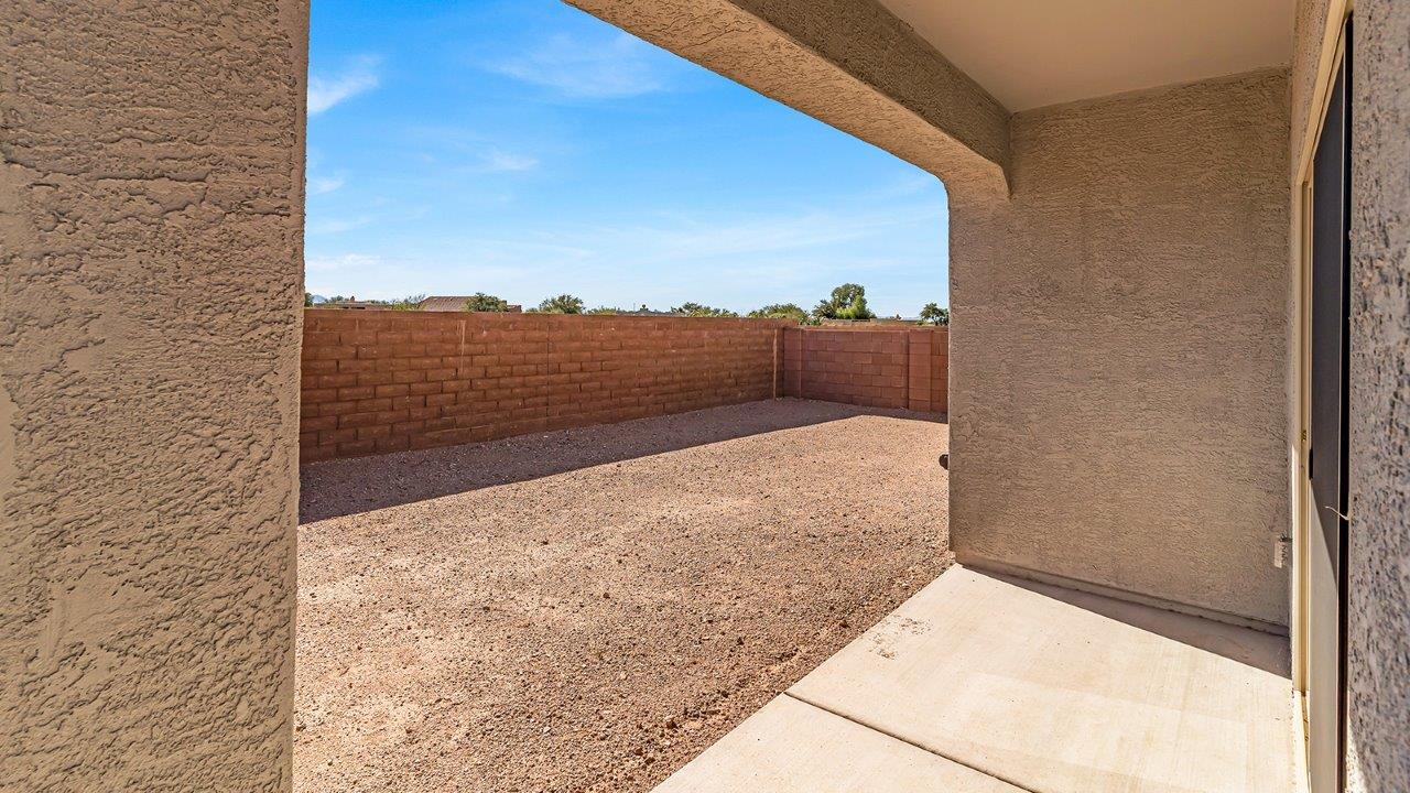 Discover The Harris, a beautifully designed new home at The Oasis at Rocking K, located in the serene surroundings of Vail, Arizona.  This charming one-story new home offers a seamless blend of style, functionality, and comfort, perfect for families and individuals alike. The Harris spans 1,856 square feet and includes four spacious bedrooms, two-and-a-half bathrooms, and a two-car garage, all meticulously crafted to meet the needs of modern living.  The exterior of The Harris offers three elevation options, each featuring D.R. Horton’s signature Spanish lace stucco, tile roofs, and professionally landscaped front yards with auto drip irrigation, adding to the home’s curb appeal. Inside, you’re greeted by an inviting foyer that leads to an open-concept living area, where the great room flows effortlessly into the dining area and a modern kitchen.  The kitchen is a chef's dream, equipped with top-of-the-line stainless steel appliances, quartz countertops, a large center island, and 42” shaker-style cabinets with stylish cabinet pulls. Adjacent to the kitchen, the dining area is perfect for family meals or entertaining guests. The great room, with its ample natural light and direct access to the covered patio, provides a perfect space for relaxation and gatherings.  The primary bedroom is a private sanctuary located at the back of the home, offering tranquility and easy access to the backyard. It features a walk-in closet and a luxurious en-suite bathroom with dual sinks and a large walk-in shower. The additional three bedrooms are generously sized, with two sharing a well-appointed full bathroom. A powder room, strategically placed near the living areas, adds convenience for guests.  Living at The Oasis at Rocking K means enjoying a variety of amenities, including ramadas, picnic areas, and access to the greater Rocking K master-planned community’s parks, walking trails, recreational facilities and events. Each home in this community also comes equipped with D.R. Horton’s Home is Connected® Smart Home package, offering the latest in modern living with features like a smart thermostat, video doorbell, and more.  Whether you’re looking for a home that offers space, style, or a sense of community, The Harris at The Oasis at Rocking K provides it all in a location that’s close to everything you need in Vail, Arizona.