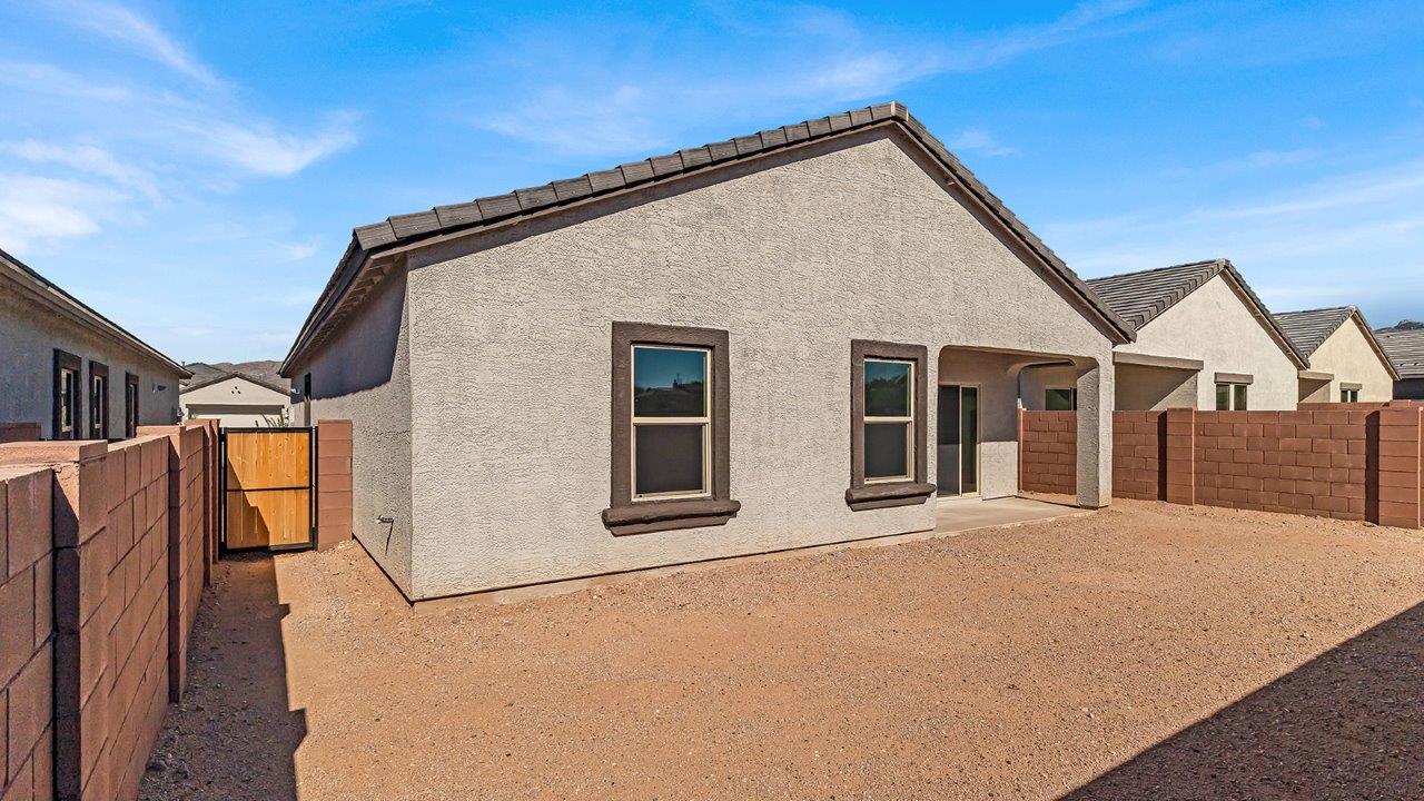 Discover The Harris, a beautifully designed new home at The Oasis at Rocking K, located in the serene surroundings of Vail, Arizona.  This charming one-story new home offers a seamless blend of style, functionality, and comfort, perfect for families and individuals alike. The Harris spans 1,856 square feet and includes four spacious bedrooms, two-and-a-half bathrooms, and a two-car garage, all meticulously crafted to meet the needs of modern living.  The exterior of The Harris offers three elevation options, each featuring D.R. Horton’s signature Spanish lace stucco, tile roofs, and professionally landscaped front yards with auto drip irrigation, adding to the home’s curb appeal. Inside, you’re greeted by an inviting foyer that leads to an open-concept living area, where the great room flows effortlessly into the dining area and a modern kitchen.  The kitchen is a chef's dream, equipped with top-of-the-line stainless steel appliances, quartz countertops, a large center island, and 42” shaker-style cabinets with stylish cabinet pulls. Adjacent to the kitchen, the dining area is perfect for family meals or entertaining guests. The great room, with its ample natural light and direct access to the covered patio, provides a perfect space for relaxation and gatherings.  The primary bedroom is a private sanctuary located at the back of the home, offering tranquility and easy access to the backyard. It features a walk-in closet and a luxurious en-suite bathroom with dual sinks and a large walk-in shower. The additional three bedrooms are generously sized, with two sharing a well-appointed full bathroom. A powder room, strategically placed near the living areas, adds convenience for guests.  Living at The Oasis at Rocking K means enjoying a variety of amenities, including ramadas, picnic areas, and access to the greater Rocking K master-planned community’s parks, walking trails, recreational facilities and events. Each home in this community also comes equipped with D.R. Horton’s Home is Connected® Smart Home package, offering the latest in modern living with features like a smart thermostat, video doorbell, and more.  Whether you’re looking for a home that offers space, style, or a sense of community, The Harris at The Oasis at Rocking K provides it all in a location that’s close to everything you need in Vail, Arizona.