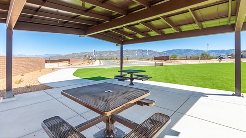 Welcome to The Oasis at Rocking K, a premier D.R. Horton new home community nestled in the picturesque landscapes of Vail, Arizona, where new homes blend seamlessly with the breathtaking surroundings of the Rincon Mountains. Experience the perfect balance of tranquility and modern convenience in this master-planned neighborhood, designed to offer a lifestyle that caters to families, nature enthusiasts, and anyone seeking a peaceful yet connected community. The Oasis at Rocking K features five beautifully designed one-story floor plans ranging from 1,400 to 1,900 square feet, each crafted with the high-quality features and finishes D.R. Horton is known for. Homes in Rocking K feature a Spanish lace stucco exterior, tile roofs, and meticulously landscaped front yards with auto drip irrigation. Inside, you’ll find luxurious quartz countertops in the kitchens and bathrooms, 42” shaker-style cabinets with modern cabinet pulls, and wood-look tile flooring throughout the main living areas. Homes also include covered front porches and back patios, perfect for enjoying Arizona’s stunning sunsets and clear night skies. Each home in The Oasis at Rocking K is equipped with D.R. Horton’s Home is Connected® Smart Home package, which includes a smart thermostat, video doorbell, keyless entry, Wi-Fi-enabled garage door opener, and Deako light switches. Additionally, these homes meet the stringent DOE Zero Energy Ready Home standards, making them not only comfortable and modern but also exceptionally energy-efficient. With features like spray foam insulation, tankless water heaters and LED lighting, these homes are designed to reduce your environmental footprint and provide long-term savings on energy costs. Living at Rocking K means being part of a vibrant, family-oriented community with a strong sense of connection among residents. The Oasis at Rocking K offers a variety of amenities, including ramadas, picnic tables, and grassy areas perfect for gatherings. Residents also have access to the greater Rocking K master-planned neighborhood amenities, such as a splashpad, large event lawn, walking paths, multipurpose fields, basketball and pickleball courts, and an innovative playground with a zip-line and jungle gym. The new K-8 school, set to open in 2025, is just one of the many features that make Rocking K ideal for families. Life at Rocking K is further enriched by a lively calendar of lifestyle events, thoughtfully organized by the Rocking K Homeowners Association. These events are a cornerstone of community life, fostering a strong sense of connection among residents. Whether you’re looking to enjoy a quiet evening star gazing in the park or engage in fun activities with neighbors, there’s always something happening. The quarterly lifestyle calendar is packed with regular and seasonal events, including movie nights in the park, sports and summer camps for kids, and wine tasting events for adults. Families can join hiking groups, participate in trivia nights, or enjoy the various holiday celebrations. The community comes alive during the holidays with loads of themed events, arts and crafts fairs, and car shows. Rocking K’s commitment to providing a dynamic and engaging environment ensures that there’s always an opportunity to make memories and build lasting friendships right in your neighborhood. Residents of Rocking K benefit from easy access to I-10, making commutes to Tucson and surrounding areas a breeze. The community is close to major employers such as Davis-Monthan Air Force Base, Raytheon, and the University of Arizona, as well as top-notch healthcare facilities like TMC Rincon and Northwest Hospital East. The nearby Houghton Town Center and Houghton Rd. business corridor offer convenient shopping, dining, and services. For outdoor enthusiasts, Rocking K is surrounded by natural beauty and recreational opportunities. Explore the hiking and biking trails at Colossal Cave Mountain Park, Saguaro National Park East, and the Arizona Trail. Enjoy golfing at Del Lago Golf Course, or take a short drive to Sonoita for a day trip to Arizona’s Wine Country. Whether it’s hiking, camping, or simply taking in the stunning views, Rocking K is your gateway to the great outdoors. With 360-degree mountain views, calm and quiet evenings, and a location that’s close to everything you need, Rocking K is truly a community where you can thrive. Experience the best of Arizona living at The Oasis at Rocking K, where your new home awaits in a community that offers everything you need for a fulfilling lifestyle.