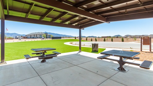 Welcome to The Oasis at Rocking K, a premier D.R. Horton new home community nestled in the picturesque landscapes of Vail, Arizona, where new homes blend seamlessly with the breathtaking surroundings of the Rincon Mountains. Experience the perfect balance of tranquility and modern convenience in this master-planned neighborhood, designed to offer a lifestyle that caters to families, nature enthusiasts, and anyone seeking a peaceful yet connected community. The Oasis at Rocking K features five beautifully designed one-story floor plans ranging from 1,400 to 1,900 square feet, each crafted with the high-quality features and finishes D.R. Horton is known for. Homes in Rocking K feature a Spanish lace stucco exterior, tile roofs, and meticulously landscaped front yards with auto drip irrigation. Inside, you’ll find luxurious quartz countertops in the kitchens and bathrooms, 42” shaker-style cabinets with modern cabinet pulls, and wood-look tile flooring throughout the main living areas. Homes also include covered front porches and back patios, perfect for enjoying Arizona’s stunning sunsets and clear night skies. Each home in The Oasis at Rocking K is equipped with D.R. Horton’s Home is Connected® Smart Home package, which includes a smart thermostat, video doorbell, keyless entry, Wi-Fi-enabled garage door opener, and Deako light switches. Additionally, these homes meet the stringent DOE Zero Energy Ready Home standards, making them not only comfortable and modern but also exceptionally energy-efficient. With features like spray foam insulation, tankless water heaters and LED lighting, these homes are designed to reduce your environmental footprint and provide long-term savings on energy costs. Living at Rocking K means being part of a vibrant, family-oriented community with a strong sense of connection among residents. The Oasis at Rocking K offers a variety of amenities, including ramadas, picnic tables, and grassy areas perfect for gatherings. Residents also have access to the greater Rocking K master-planned neighborhood amenities, such as a splashpad, large event lawn, walking paths, multipurpose fields, basketball and pickleball courts, and an innovative playground with a zip-line and jungle gym. The new K-8 school, set to open in 2025, is just one of the many features that make Rocking K ideal for families. Life at Rocking K is further enriched by a lively calendar of lifestyle events, thoughtfully organized by the Rocking K Homeowners Association. These events are a cornerstone of community life, fostering a strong sense of connection among residents. Whether you’re looking to enjoy a quiet evening star gazing in the park or engage in fun activities with neighbors, there’s always something happening. The quarterly lifestyle calendar is packed with regular and seasonal events, including movie nights in the park, sports and summer camps for kids, and wine tasting events for adults. Families can join hiking groups, participate in trivia nights, or enjoy the various holiday celebrations. The community comes alive during the holidays with loads of themed events, arts and crafts fairs, and car shows. Rocking K’s commitment to providing a dynamic and engaging environment ensures that there’s always an opportunity to make memories and build lasting friendships right in your neighborhood. Residents of Rocking K benefit from easy access to I-10, making commutes to Tucson and surrounding areas a breeze. The community is close to major employers such as Davis-Monthan Air Force Base, Raytheon, and the University of Arizona, as well as top-notch healthcare facilities like TMC Rincon and Northwest Hospital East. The nearby Houghton Town Center and Houghton Rd. business corridor offer convenient shopping, dining, and services. For outdoor enthusiasts, Rocking K is surrounded by natural beauty and recreational opportunities. Explore the hiking and biking trails at Colossal Cave Mountain Park, Saguaro National Park East, and the Arizona Trail. Enjoy golfing at Del Lago Golf Course, or take a short drive to Sonoita for a day trip to Arizona’s Wine Country. Whether it’s hiking, camping, or simply taking in the stunning views, Rocking K is your gateway to the great outdoors. With 360-degree mountain views, calm and quiet evenings, and a location that’s close to everything you need, Rocking K is truly a community where you can thrive. Experience the best of Arizona living at The Oasis at Rocking K, where your new home awaits in a community that offers everything you need for a fulfilling lifestyle.