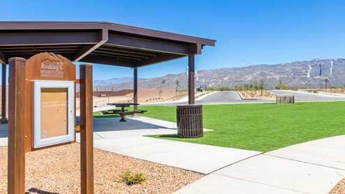 Welcome to The Oasis at Rocking K, a premier D.R. Horton new home community nestled in the picturesque landscapes of Vail, Arizona, where new homes blend seamlessly with the breathtaking surroundings of the Rincon Mountains. Experience the perfect balance of tranquility and modern convenience in this master-planned neighborhood, designed to offer a lifestyle that caters to families, nature enthusiasts, and anyone seeking a peaceful yet connected community. The Oasis at Rocking K features five beautifully designed one-story floor plans ranging from 1,400 to 1,900 square feet, each crafted with the high-quality features and finishes D.R. Horton is known for. Homes in Rocking K feature a Spanish lace stucco exterior, tile roofs, and meticulously landscaped front yards with auto drip irrigation. Inside, you’ll find luxurious quartz countertops in the kitchens and bathrooms, 42” shaker-style cabinets with modern cabinet pulls, and wood-look tile flooring throughout the main living areas. Homes also include covered front porches and back patios, perfect for enjoying Arizona’s stunning sunsets and clear night skies. Each home in The Oasis at Rocking K is equipped with D.R. Horton’s Home is Connected® Smart Home package, which includes a smart thermostat, video doorbell, keyless entry, Wi-Fi-enabled garage door opener, and Deako light switches. Additionally, these homes meet the stringent DOE Zero Energy Ready Home standards, making them not only comfortable and modern but also exceptionally energy-efficient. With features like spray foam insulation, tankless water heaters and LED lighting, these homes are designed to reduce your environmental footprint and provide long-term savings on energy costs. Living at Rocking K means being part of a vibrant, family-oriented community with a strong sense of connection among residents. The Oasis at Rocking K offers a variety of amenities, including ramadas, picnic tables, and grassy areas perfect for gatherings. Residents also have access to the greater Rocking K master-planned neighborhood amenities, such as a splashpad, large event lawn, walking paths, multipurpose fields, basketball and pickleball courts, and an innovative playground with a zip-line and jungle gym. The new K-8 school, set to open in 2025, is just one of the many features that make Rocking K ideal for families. Life at Rocking K is further enriched by a lively calendar of lifestyle events, thoughtfully organized by the Rocking K Homeowners Association. These events are a cornerstone of community life, fostering a strong sense of connection among residents. Whether you’re looking to enjoy a quiet evening star gazing in the park or engage in fun activities with neighbors, there’s always something happening. The quarterly lifestyle calendar is packed with regular and seasonal events, including movie nights in the park, sports and summer camps for kids, and wine tasting events for adults. Families can join hiking groups, participate in trivia nights, or enjoy the various holiday celebrations. The community comes alive during the holidays with loads of themed events, arts and crafts fairs, and car shows. Rocking K’s commitment to providing a dynamic and engaging environment ensures that there’s always an opportunity to make memories and build lasting friendships right in your neighborhood. Residents of Rocking K benefit from easy access to I-10, making commutes to Tucson and surrounding areas a breeze. The community is close to major employers such as Davis-Monthan Air Force Base, Raytheon, and the University of Arizona, as well as top-notch healthcare facilities like TMC Rincon and Northwest Hospital East. The nearby Houghton Town Center and Houghton Rd. business corridor offer convenient shopping, dining, and services. For outdoor enthusiasts, Rocking K is surrounded by natural beauty and recreational opportunities. Explore the hiking and biking trails at Colossal Cave Mountain Park, Saguaro National Park East, and the Arizona Trail. Enjoy golfing at Del Lago Golf Course, or take a short drive to Sonoita for a day trip to Arizona’s Wine Country. Whether it’s hiking, camping, or simply taking in the stunning views, Rocking K is your gateway to the great outdoors. With 360-degree mountain views, calm and quiet evenings, and a location that’s close to everything you need, Rocking K is truly a community where you can thrive. Experience the best of Arizona living at The Oasis at Rocking K, where your new home awaits in a community that offers everything you need for a fulfilling lifestyle.