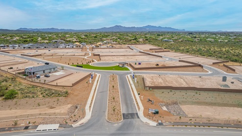 Welcome to The Oasis at Rocking K, a premier D.R. Horton new home community nestled in the picturesque landscapes of Vail, Arizona, where new homes blend seamlessly with the breathtaking surroundings of the Rincon Mountains. Experience the perfect balance of tranquility and modern convenience in this master-planned neighborhood, designed to offer a lifestyle that caters to families, nature enthusiasts, and anyone seeking a peaceful yet connected community. The Oasis at Rocking K features five beautifully designed one-story floor plans ranging from 1,400 to 1,900 square feet, each crafted with the high-quality features and finishes D.R. Horton is known for. Homes in Rocking K feature a Spanish lace stucco exterior, tile roofs, and meticulously landscaped front yards with auto drip irrigation. Inside, you’ll find luxurious quartz countertops in the kitchens and bathrooms, 42” shaker-style cabinets with modern cabinet pulls, and wood-look tile flooring throughout the main living areas. Homes also include covered front porches and back patios, perfect for enjoying Arizona’s stunning sunsets and clear night skies. Each home in The Oasis at Rocking K is equipped with D.R. Horton’s Home is Connected® Smart Home package, which includes a smart thermostat, video doorbell, keyless entry, Wi-Fi-enabled garage door opener, and Deako light switches. Additionally, these homes meet the stringent DOE Zero Energy Ready Home standards, making them not only comfortable and modern but also exceptionally energy-efficient. With features like spray foam insulation, tankless water heaters and LED lighting, these homes are designed to reduce your environmental footprint and provide long-term savings on energy costs. Living at Rocking K means being part of a vibrant, family-oriented community with a strong sense of connection among residents. The Oasis at Rocking K offers a variety of amenities, including ramadas, picnic tables, and grassy areas perfect for gatherings. Residents also have access to the greater Rocking K master-planned neighborhood amenities, such as a splashpad, large event lawn, walking paths, multipurpose fields, basketball and pickleball courts, and an innovative playground with a zip-line and jungle gym. The new K-8 school, set to open in 2025, is just one of the many features that make Rocking K ideal for families. Life at Rocking K is further enriched by a lively calendar of lifestyle events, thoughtfully organized by the Rocking K Homeowners Association. These events are a cornerstone of community life, fostering a strong sense of connection among residents. Whether you’re looking to enjoy a quiet evening star gazing in the park or engage in fun activities with neighbors, there’s always something happening. The quarterly lifestyle calendar is packed with regular and seasonal events, including movie nights in the park, sports and summer camps for kids, and wine tasting events for adults. Families can join hiking groups, participate in trivia nights, or enjoy the various holiday celebrations. The community comes alive during the holidays with loads of themed events, arts and crafts fairs, and car shows. Rocking K’s commitment to providing a dynamic and engaging environment ensures that there’s always an opportunity to make memories and build lasting friendships right in your neighborhood. Residents of Rocking K benefit from easy access to I-10, making commutes to Tucson and surrounding areas a breeze. The community is close to major employers such as Davis-Monthan Air Force Base, Raytheon, and the University of Arizona, as well as top-notch healthcare facilities like TMC Rincon and Northwest Hospital East. The nearby Houghton Town Center and Houghton Rd. business corridor offer convenient shopping, dining, and services. For outdoor enthusiasts, Rocking K is surrounded by natural beauty and recreational opportunities. Explore the hiking and biking trails at Colossal Cave Mountain Park, Saguaro National Park East, and the Arizona Trail. Enjoy golfing at Del Lago Golf Course, or take a short drive to Sonoita for a day trip to Arizona’s Wine Country. Whether it’s hiking, camping, or simply taking in the stunning views, Rocking K is your gateway to the great outdoors. With 360-degree mountain views, calm and quiet evenings, and a location that’s close to everything you need, Rocking K is truly a community where you can thrive. Experience the best of Arizona living at The Oasis at Rocking K, where your new home awaits in a community that offers everything you need for a fulfilling lifestyle.