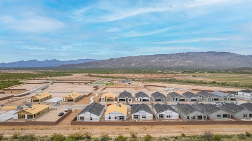 Welcome to The Oasis at Rocking K, a premier D.R. Horton new home community nestled in the picturesque landscapes of Vail, Arizona, where new homes blend seamlessly with the breathtaking surroundings of the Rincon Mountains. Experience the perfect balance of tranquility and modern convenience in this master-planned neighborhood, designed to offer a lifestyle that caters to families, nature enthusiasts, and anyone seeking a peaceful yet connected community. The Oasis at Rocking K features five beautifully designed one-story floor plans ranging from 1,400 to 1,900 square feet, each crafted with the high-quality features and finishes D.R. Horton is known for. Homes in Rocking K feature a Spanish lace stucco exterior, tile roofs, and meticulously landscaped front yards with auto drip irrigation. Inside, you’ll find luxurious quartz countertops in the kitchens and bathrooms, 42” shaker-style cabinets with modern cabinet pulls, and wood-look tile flooring throughout the main living areas. Homes also include covered front porches and back patios, perfect for enjoying Arizona’s stunning sunsets and clear night skies. Each home in The Oasis at Rocking K is equipped with D.R. Horton’s Home is Connected® Smart Home package, which includes a smart thermostat, video doorbell, keyless entry, Wi-Fi-enabled garage door opener, and Deako light switches. Additionally, these homes meet the stringent DOE Zero Energy Ready Home standards, making them not only comfortable and modern but also exceptionally energy-efficient. With features like spray foam insulation, tankless water heaters and LED lighting, these homes are designed to reduce your environmental footprint and provide long-term savings on energy costs. Living at Rocking K means being part of a vibrant, family-oriented community with a strong sense of connection among residents. The Oasis at Rocking K offers a variety of amenities, including ramadas, picnic tables, and grassy areas perfect for gatherings. Residents also have access to the greater Rocking K master-planned neighborhood amenities, such as a splashpad, large event lawn, walking paths, multipurpose fields, basketball and pickleball courts, and an innovative playground with a zip-line and jungle gym. The new K-8 school, set to open in 2025, is just one of the many features that make Rocking K ideal for families. Life at Rocking K is further enriched by a lively calendar of lifestyle events, thoughtfully organized by the Rocking K Homeowners Association. These events are a cornerstone of community life, fostering a strong sense of connection among residents. Whether you’re looking to enjoy a quiet evening star gazing in the park or engage in fun activities with neighbors, there’s always something happening. The quarterly lifestyle calendar is packed with regular and seasonal events, including movie nights in the park, sports and summer camps for kids, and wine tasting events for adults. Families can join hiking groups, participate in trivia nights, or enjoy the various holiday celebrations. The community comes alive during the holidays with loads of themed events, arts and crafts fairs, and car shows. Rocking K’s commitment to providing a dynamic and engaging environment ensures that there’s always an opportunity to make memories and build lasting friendships right in your neighborhood. Residents of Rocking K benefit from easy access to I-10, making commutes to Tucson and surrounding areas a breeze. The community is close to major employers such as Davis-Monthan Air Force Base, Raytheon, and the University of Arizona, as well as top-notch healthcare facilities like TMC Rincon and Northwest Hospital East. The nearby Houghton Town Center and Houghton Rd. business corridor offer convenient shopping, dining, and services. For outdoor enthusiasts, Rocking K is surrounded by natural beauty and recreational opportunities. Explore the hiking and biking trails at Colossal Cave Mountain Park, Saguaro National Park East, and the Arizona Trail. Enjoy golfing at Del Lago Golf Course, or take a short drive to Sonoita for a day trip to Arizona’s Wine Country. Whether it’s hiking, camping, or simply taking in the stunning views, Rocking K is your gateway to the great outdoors. With 360-degree mountain views, calm and quiet evenings, and a location that’s close to everything you need, Rocking K is truly a community where you can thrive. Experience the best of Arizona living at The Oasis at Rocking K, where your new home awaits in a community that offers everything you need for a fulfilling lifestyle.