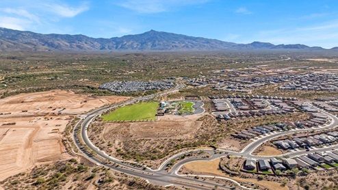 Welcome to The Oasis at Rocking K, a premier D.R. Horton new home community nestled in the picturesque landscapes of Vail, Arizona, where new homes blend seamlessly with the breathtaking surroundings of the Rincon Mountains. Experience the perfect balance of tranquility and modern convenience in this master-planned neighborhood, designed to offer a lifestyle that caters to families, nature enthusiasts, and anyone seeking a peaceful yet connected community. The Oasis at Rocking K features five beautifully designed one-story floor plans ranging from 1,400 to 1,900 square feet, each crafted with the high-quality features and finishes D.R. Horton is known for. Homes in Rocking K feature a Spanish lace stucco exterior, tile roofs, and meticulously landscaped front yards with auto drip irrigation. Inside, you’ll find luxurious quartz countertops in the kitchens and bathrooms, 42” shaker-style cabinets with modern cabinet pulls, and wood-look tile flooring throughout the main living areas. Homes also include covered front porches and back patios, perfect for enjoying Arizona’s stunning sunsets and clear night skies. Each home in The Oasis at Rocking K is equipped with D.R. Horton’s Home is Connected® Smart Home package, which includes a smart thermostat, video doorbell, keyless entry, Wi-Fi-enabled garage door opener, and Deako light switches. Additionally, these homes meet the stringent DOE Zero Energy Ready Home standards, making them not only comfortable and modern but also exceptionally energy-efficient. With features like spray foam insulation, tankless water heaters and LED lighting, these homes are designed to reduce your environmental footprint and provide long-term savings on energy costs. Living at Rocking K means being part of a vibrant, family-oriented community with a strong sense of connection among residents. The Oasis at Rocking K offers a variety of amenities, including ramadas, picnic tables, and grassy areas perfect for gatherings. Residents also have access to the greater Rocking K master-planned neighborhood amenities, such as a splashpad, large event lawn, walking paths, multipurpose fields, basketball and pickleball courts, and an innovative playground with a zip-line and jungle gym. The new K-8 school, set to open in 2025, is just one of the many features that make Rocking K ideal for families. Life at Rocking K is further enriched by a lively calendar of lifestyle events, thoughtfully organized by the Rocking K Homeowners Association. These events are a cornerstone of community life, fostering a strong sense of connection among residents. Whether you’re looking to enjoy a quiet evening star gazing in the park or engage in fun activities with neighbors, there’s always something happening. The quarterly lifestyle calendar is packed with regular and seasonal events, including movie nights in the park, sports and summer camps for kids, and wine tasting events for adults. Families can join hiking groups, participate in trivia nights, or enjoy the various holiday celebrations. The community comes alive during the holidays with loads of themed events, arts and crafts fairs, and car shows. Rocking K’s commitment to providing a dynamic and engaging environment ensures that there’s always an opportunity to make memories and build lasting friendships right in your neighborhood. Residents of Rocking K benefit from easy access to I-10, making commutes to Tucson and surrounding areas a breeze. The community is close to major employers such as Davis-Monthan Air Force Base, Raytheon, and the University of Arizona, as well as top-notch healthcare facilities like TMC Rincon and Northwest Hospital East. The nearby Houghton Town Center and Houghton Rd. business corridor offer convenient shopping, dining, and services. For outdoor enthusiasts, Rocking K is surrounded by natural beauty and recreational opportunities. Explore the hiking and biking trails at Colossal Cave Mountain Park, Saguaro National Park East, and the Arizona Trail. Enjoy golfing at Del Lago Golf Course, or take a short drive to Sonoita for a day trip to Arizona’s Wine Country. Whether it’s hiking, camping, or simply taking in the stunning views, Rocking K is your gateway to the great outdoors. With 360-degree mountain views, calm and quiet evenings, and a location that’s close to everything you need, Rocking K is truly a community where you can thrive. Experience the best of Arizona living at The Oasis at Rocking K, where your new home awaits in a community that offers everything you need for a fulfilling lifestyle.